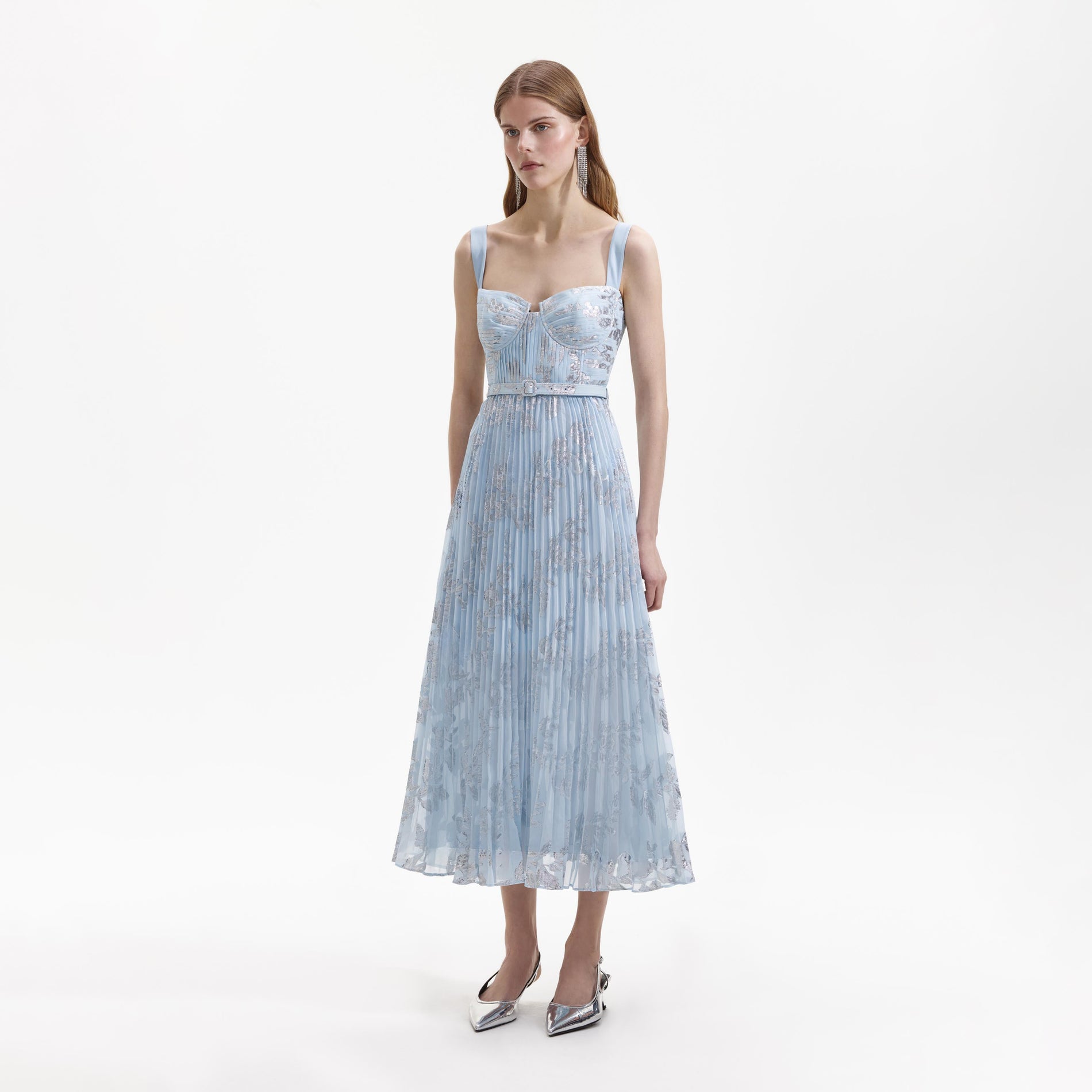 Side view of a woman wearing the Blue Pleated Midi Dress