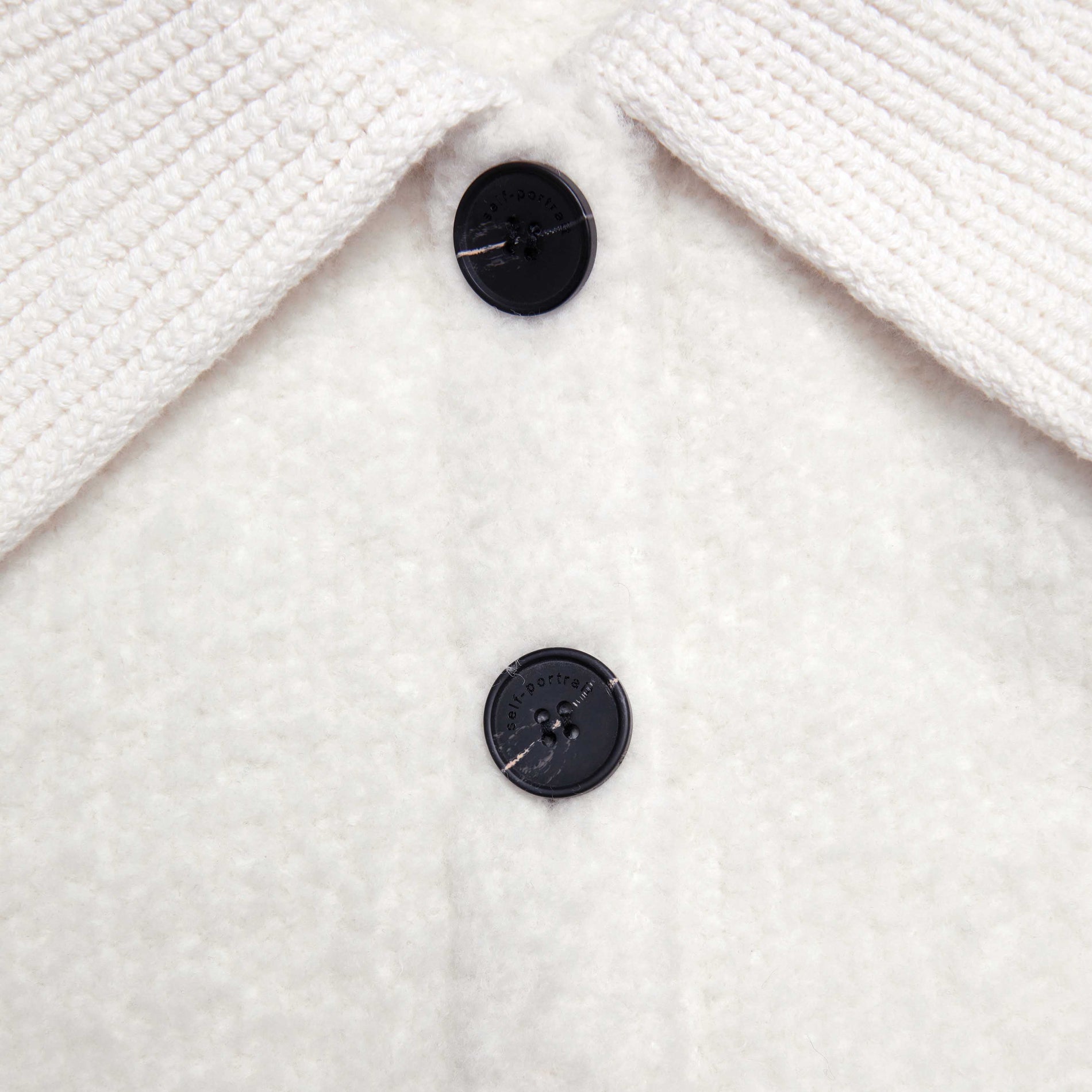 Side view of a woman wearing the Cream Fluffy Knit Cardigan