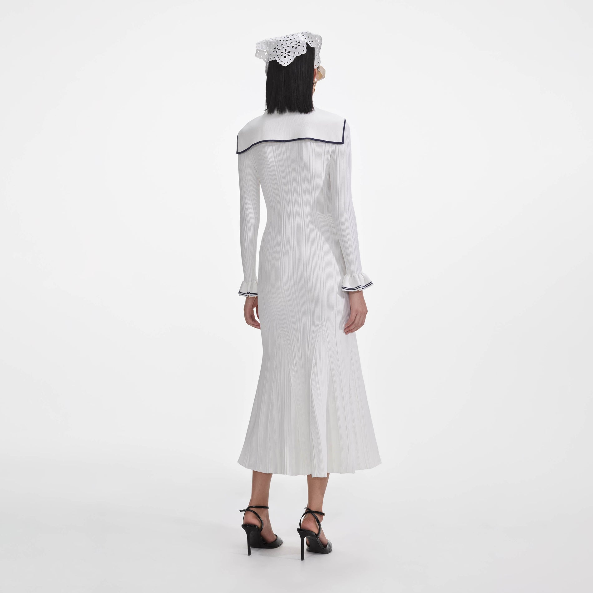 Back view of a woman wearing the White Viscose Rib Knit Midi Dress