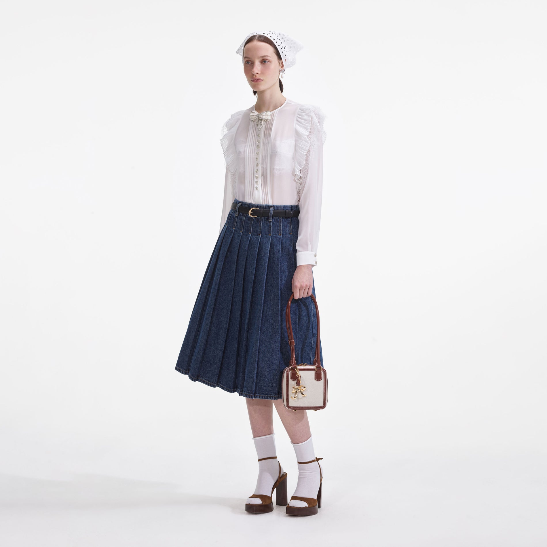 Side view of a woman wearing the White Chiffon Ruffle Top