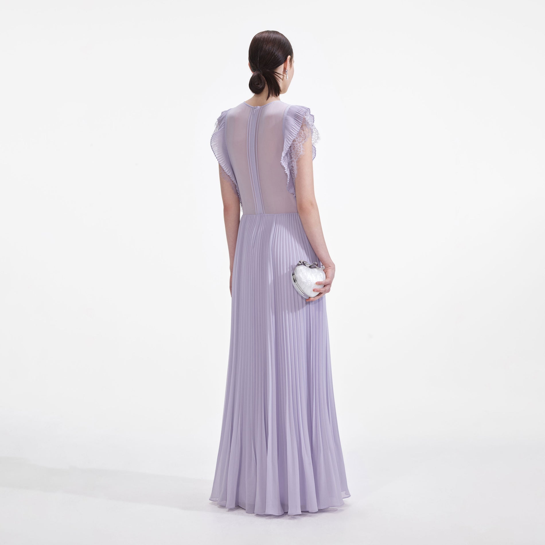 Back view of a woman wearing the Lilac Chiffon Ruffle Maxi Dress