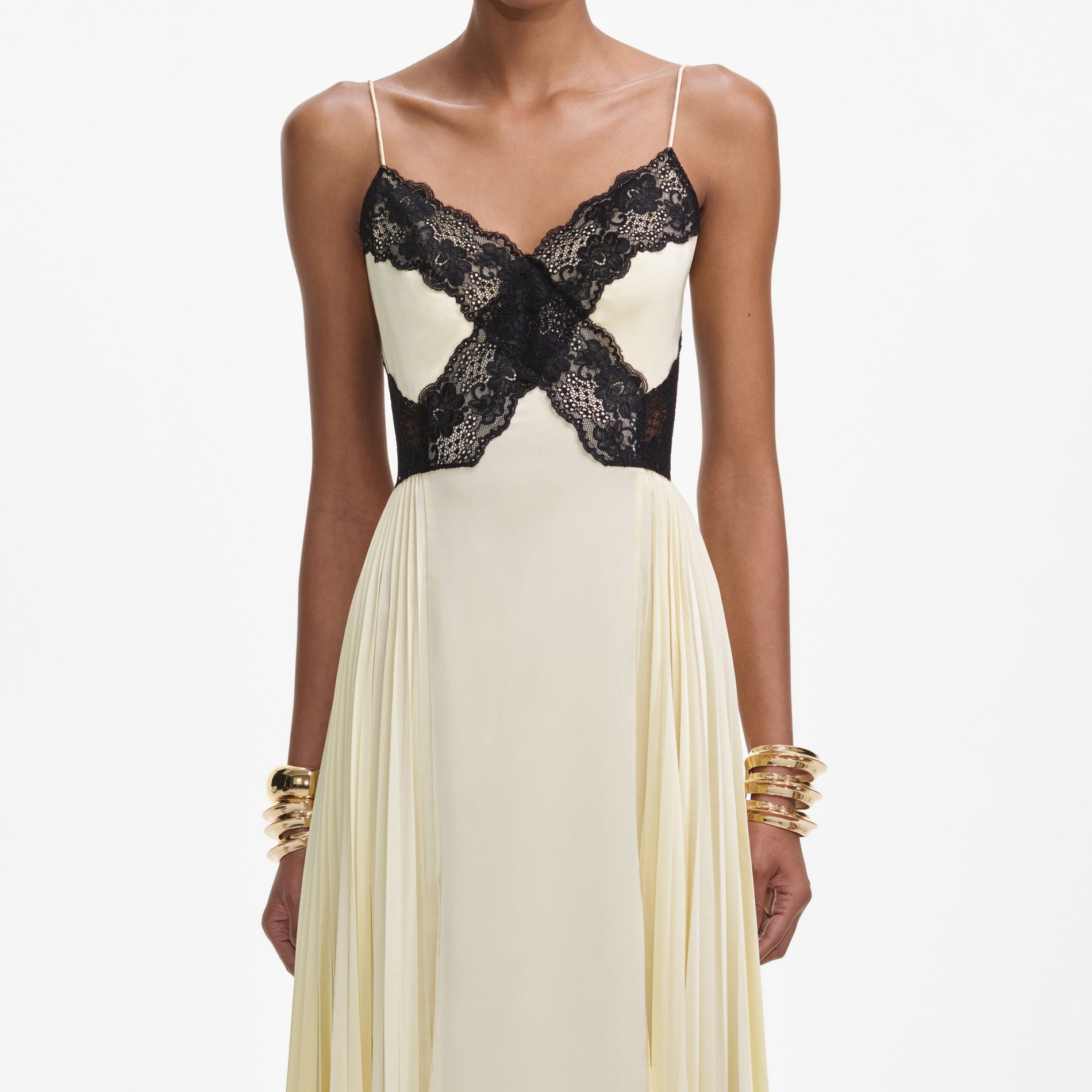 A close up of a woman wearing the Yellow Satin Lace Maxi Dress