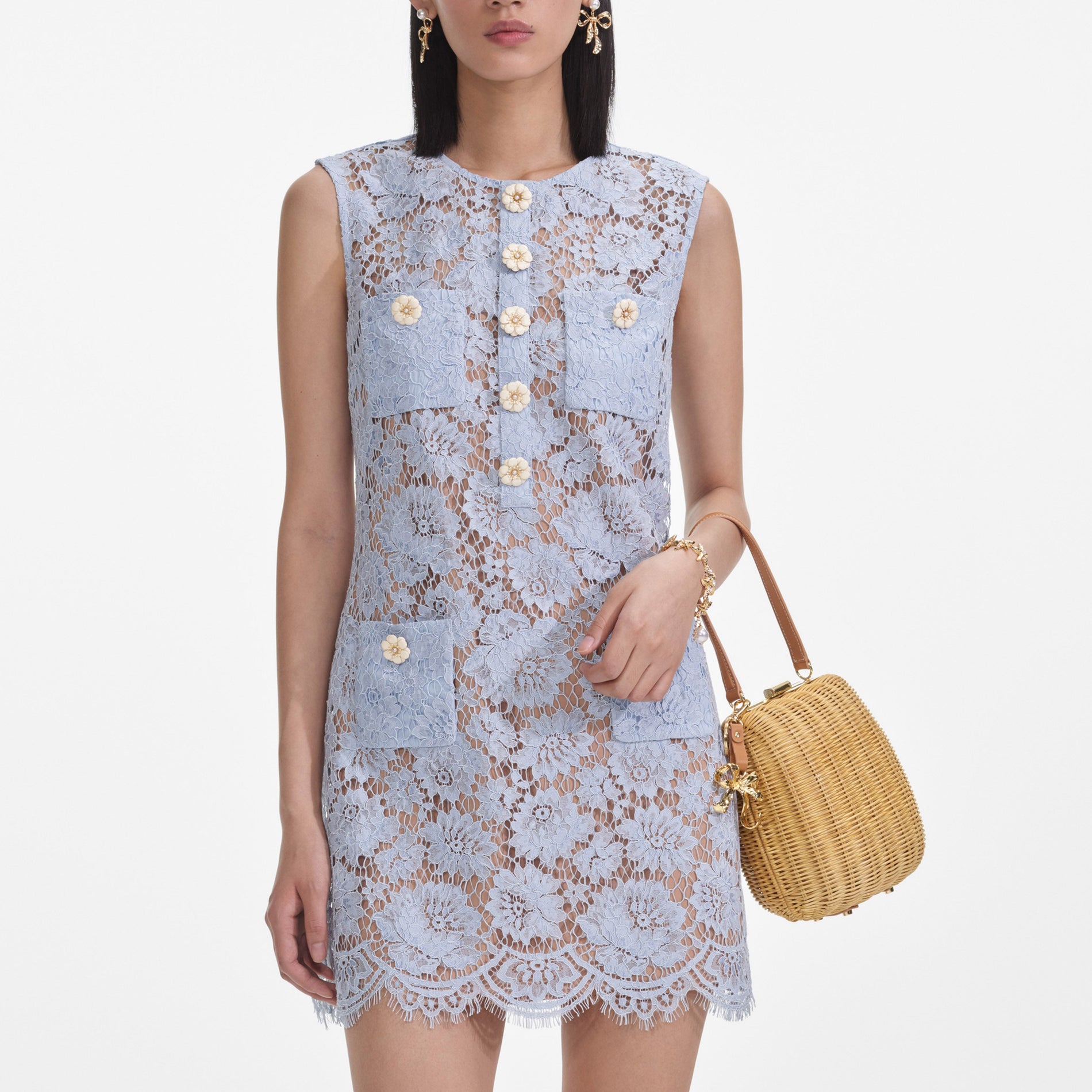 A close up of a woman wearing the Blue Fine Lace Mini Dress