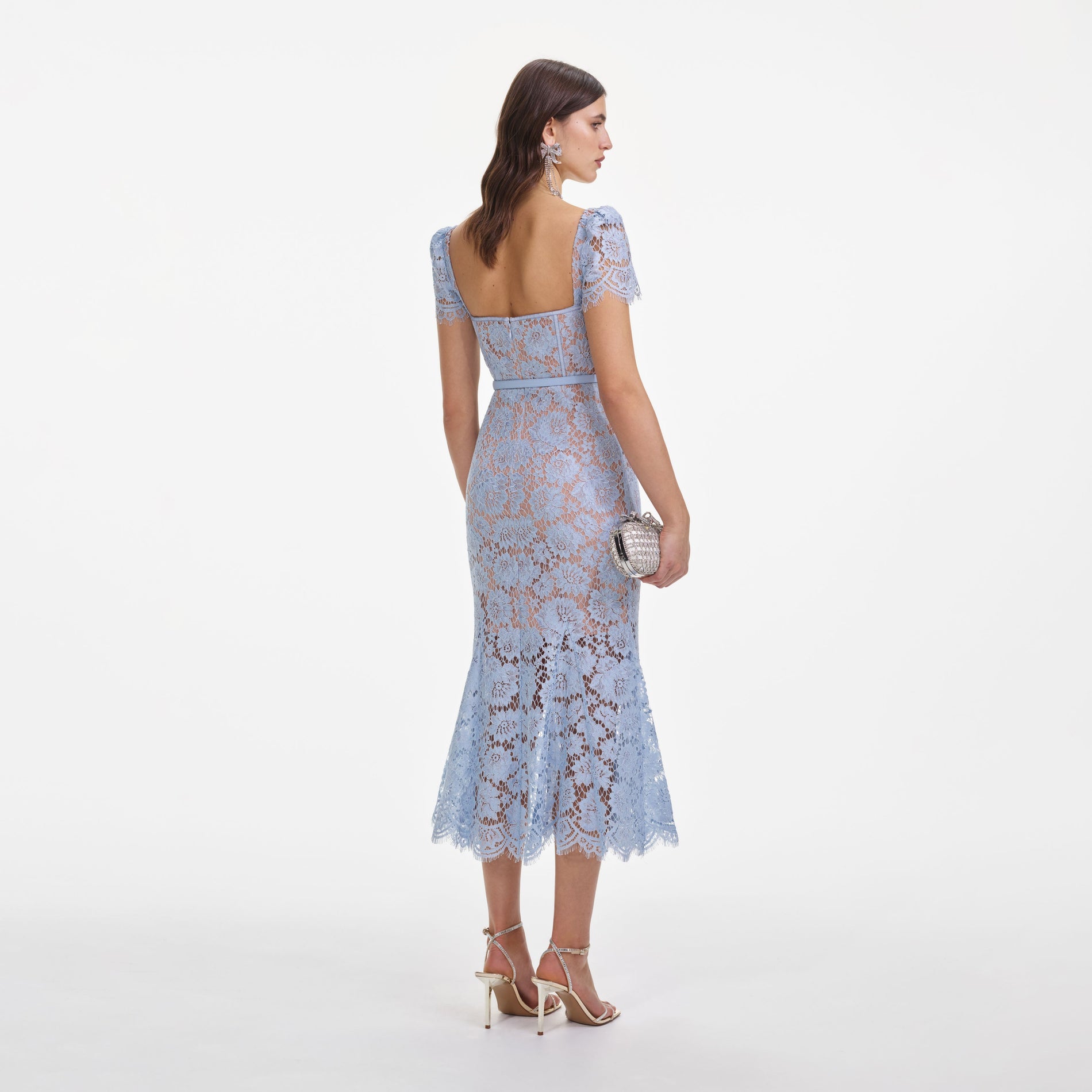 Back view of a woman wearing the Blue Fine Lace Midi Dress