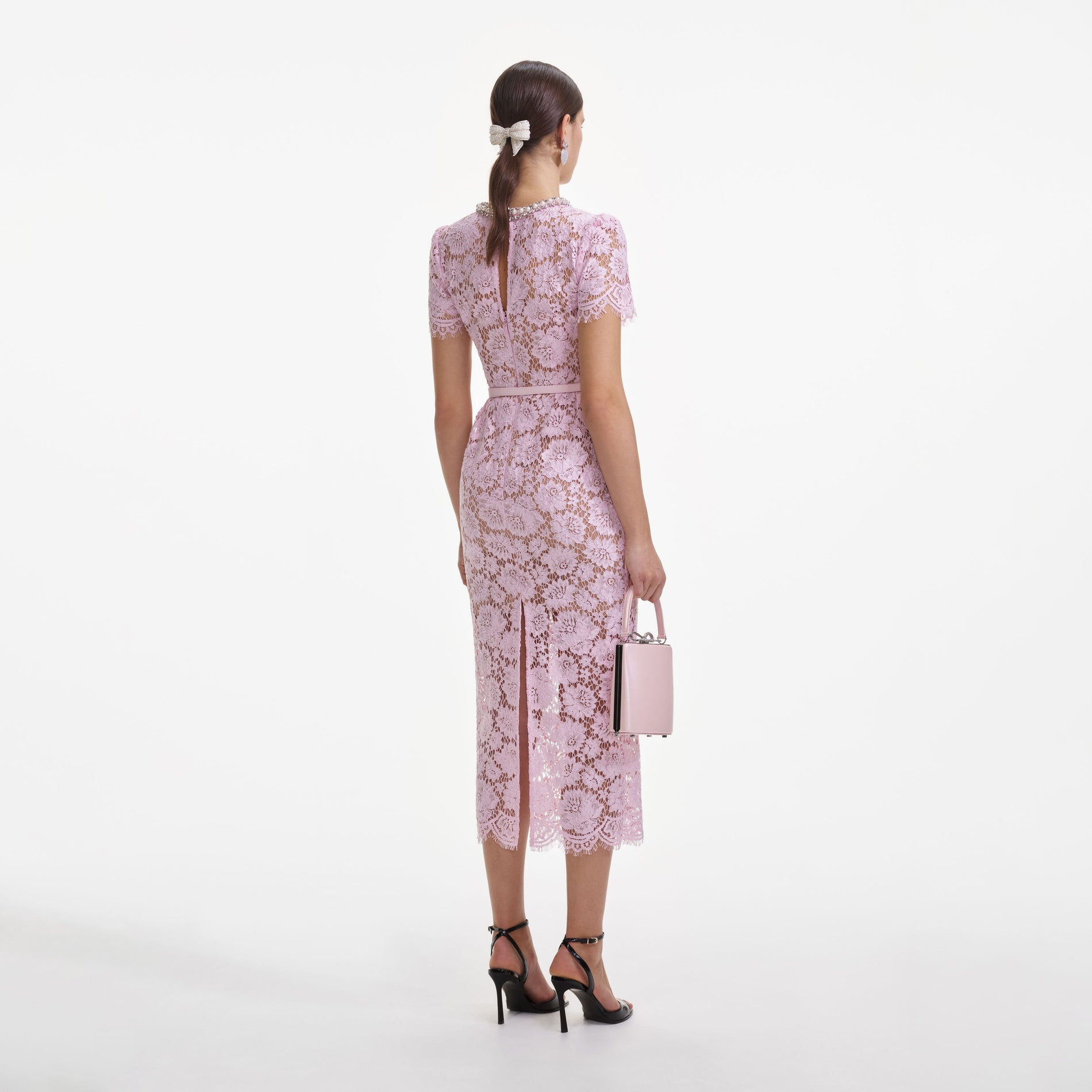 Back view of a woman wearing the Pink Fine Lace Pearl Midi Dress