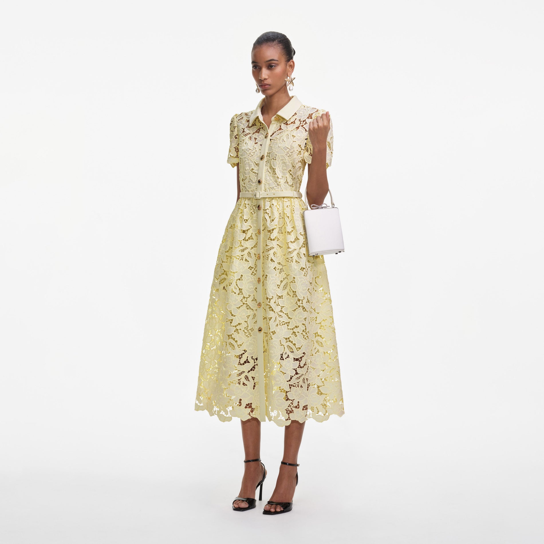 Side view of a woman wearing the Yellow Lace Collared Midi Dress