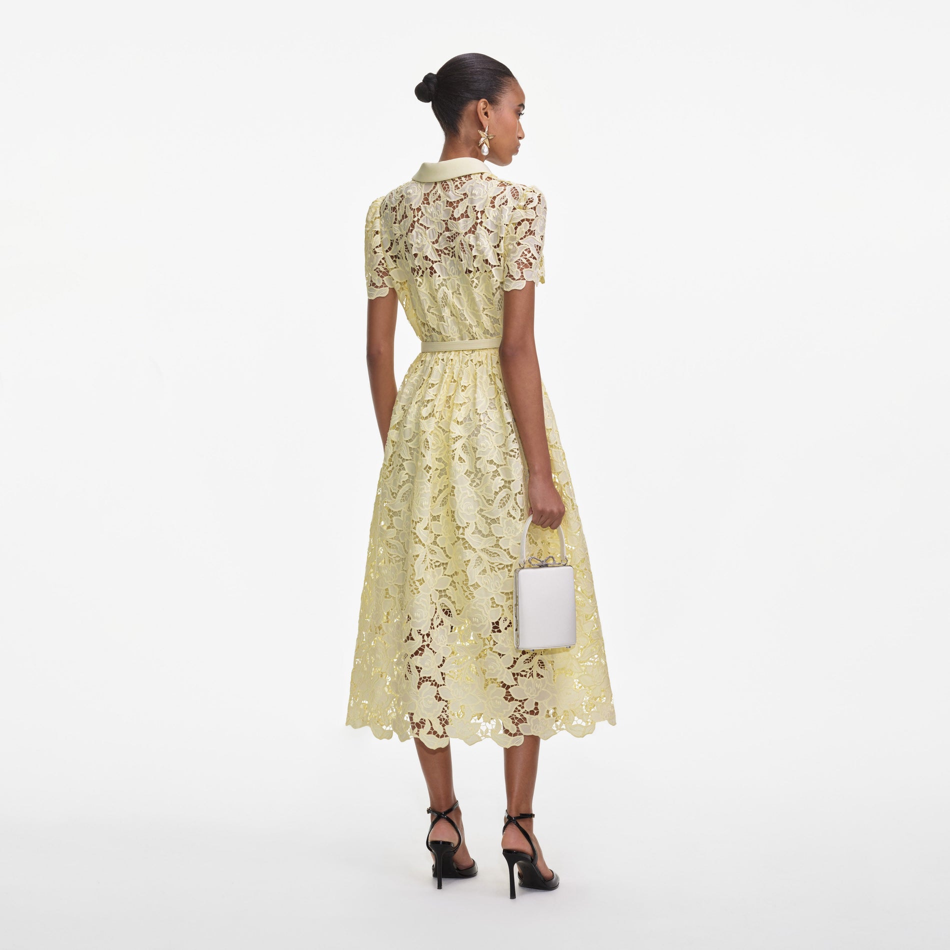 Back view of a woman wearing the Yellow Lace Collared Midi Dress