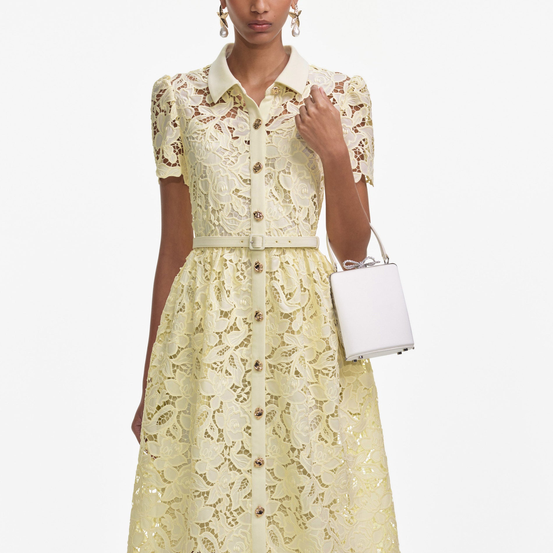 A close up of a woman wearing the Yellow Lace Collared Midi Dress