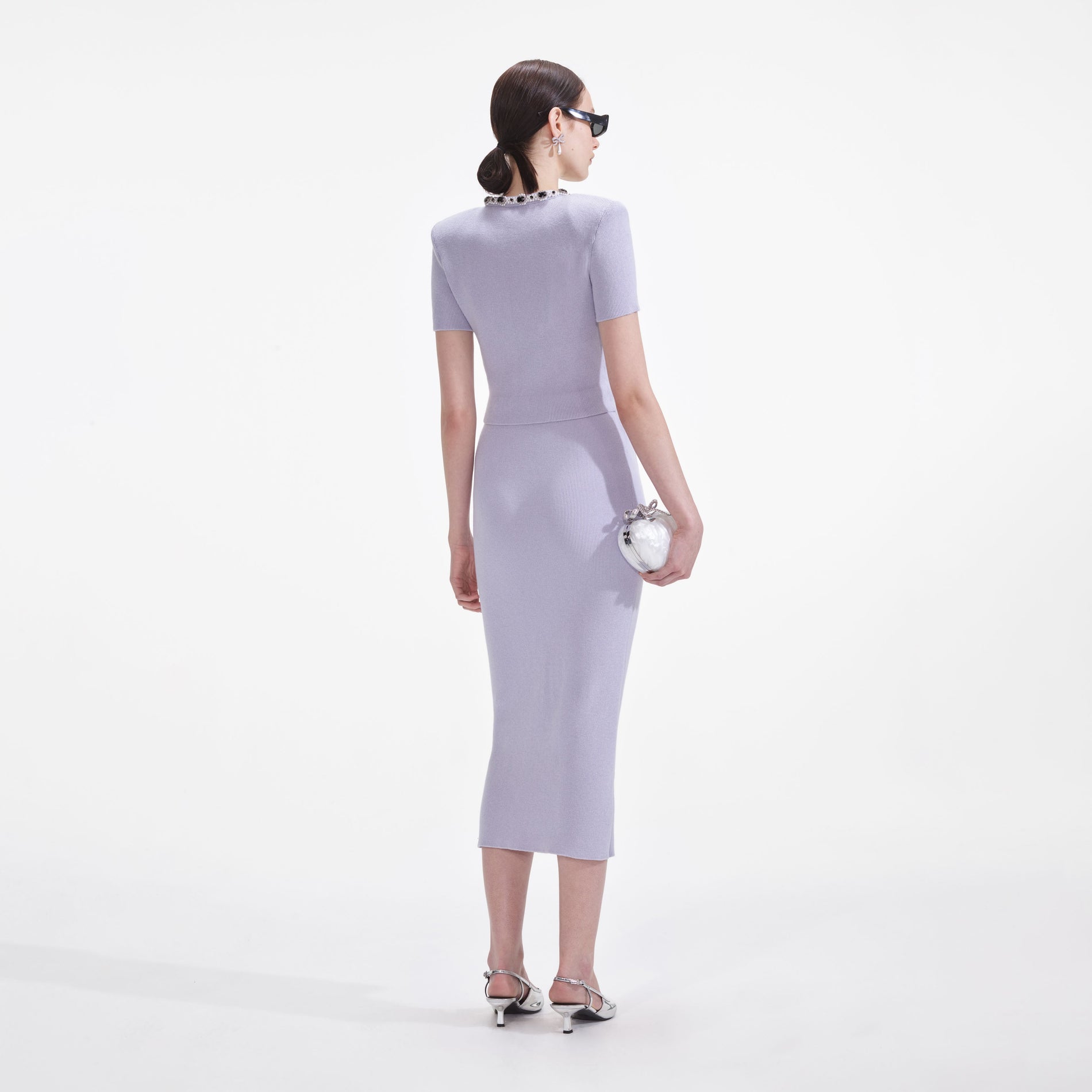 Back view of a woman wearing the Lilac Embellished Knit Midi Skirt