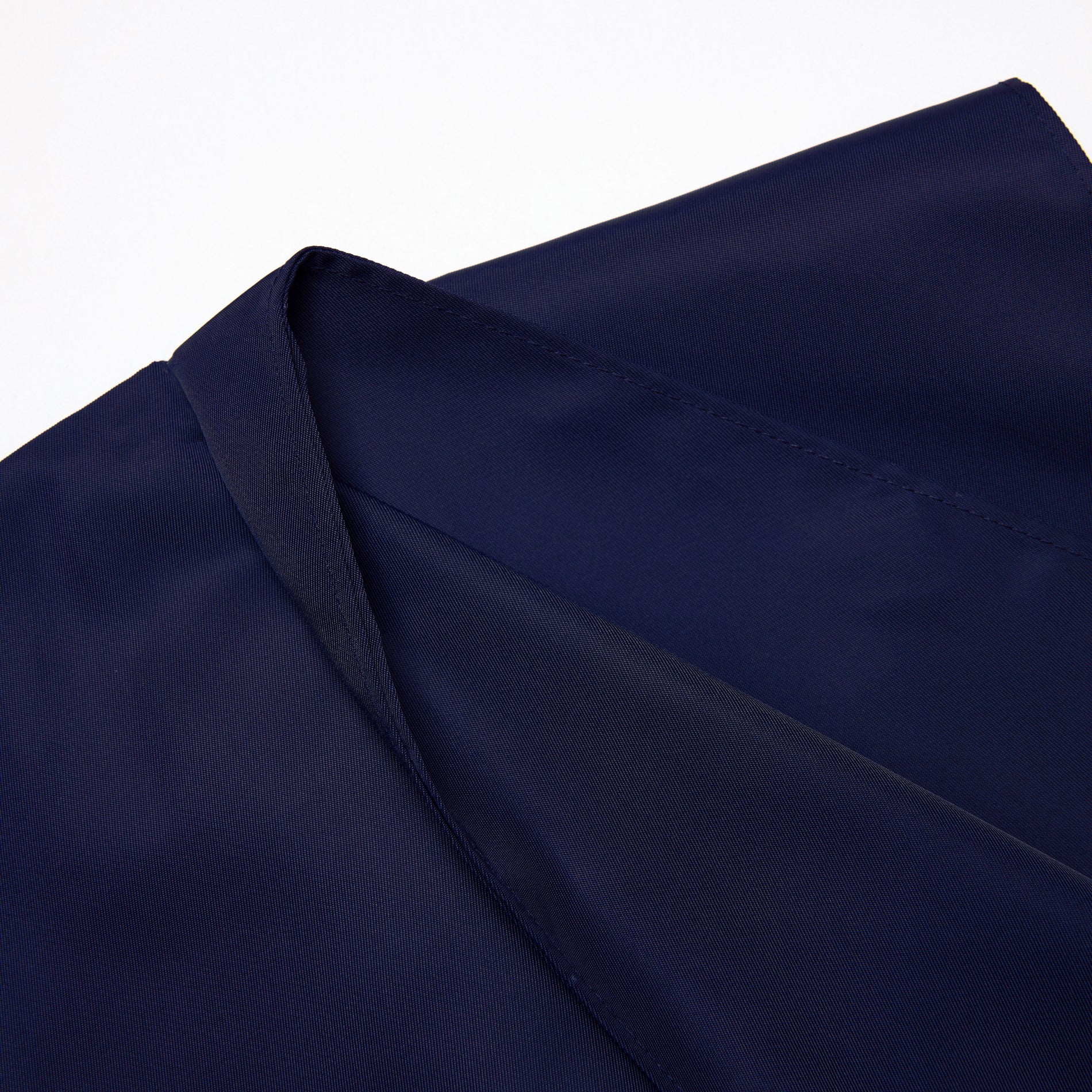 Side view of a woman wearing the Navy Nylon Mini Skirt