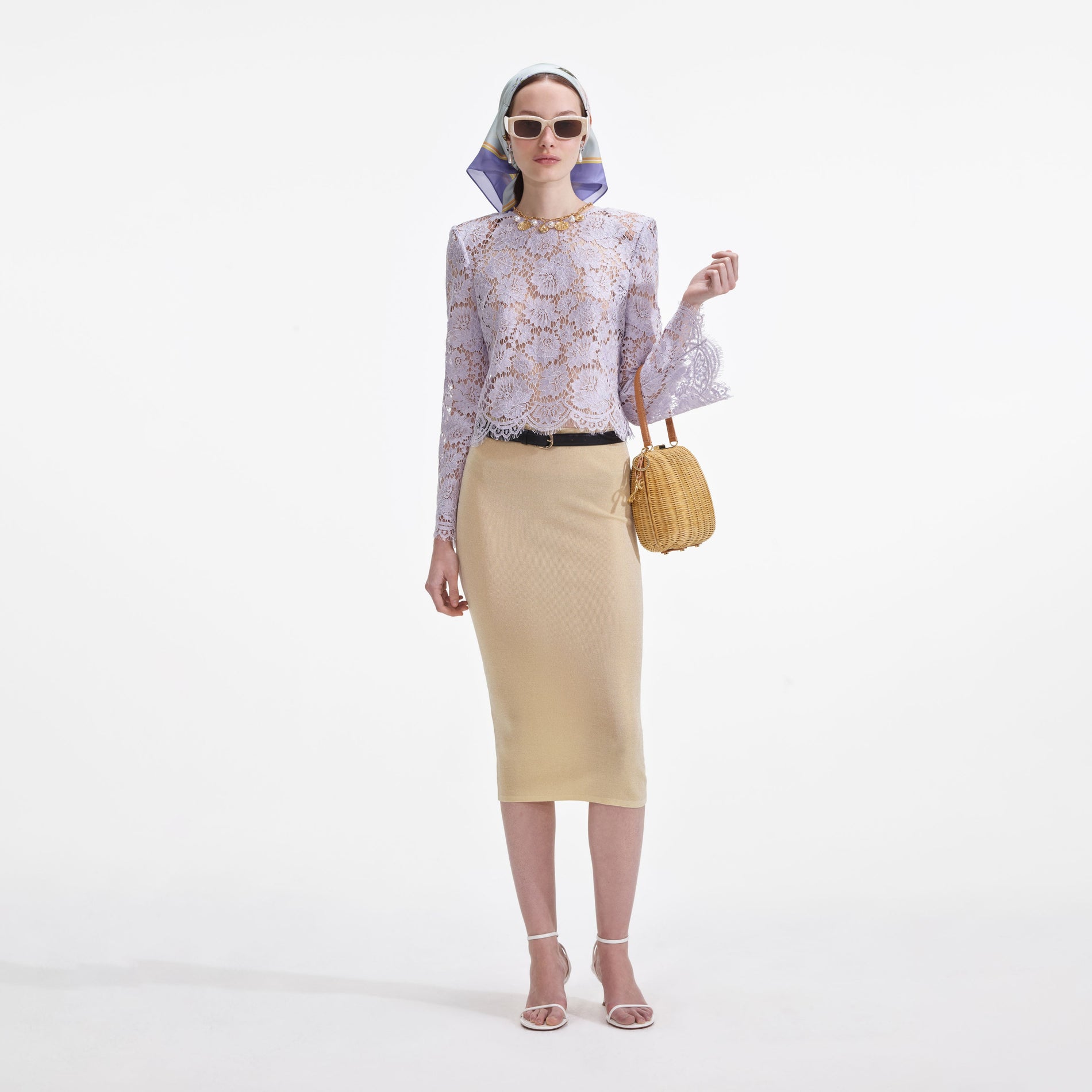 A close up of a woman wearing the Yellow Viscose Knit Midi Skirt