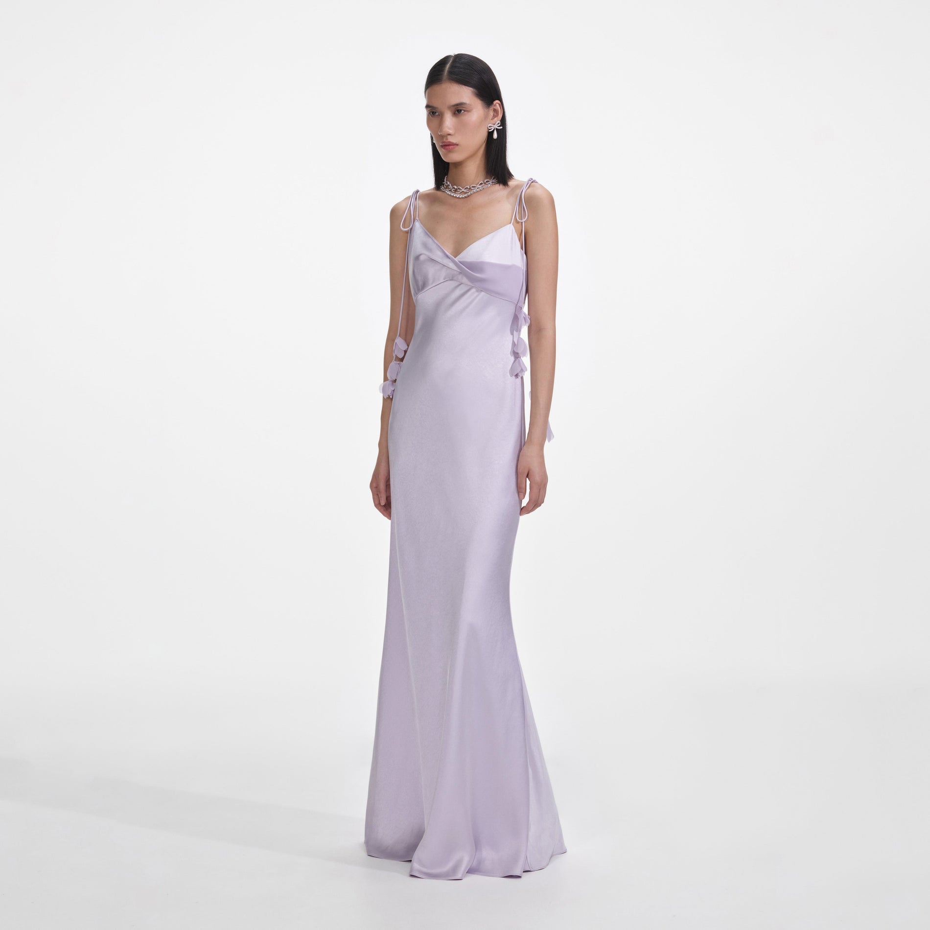 Side view of a woman wearing the Lilac Flower Satin Maxi Dress