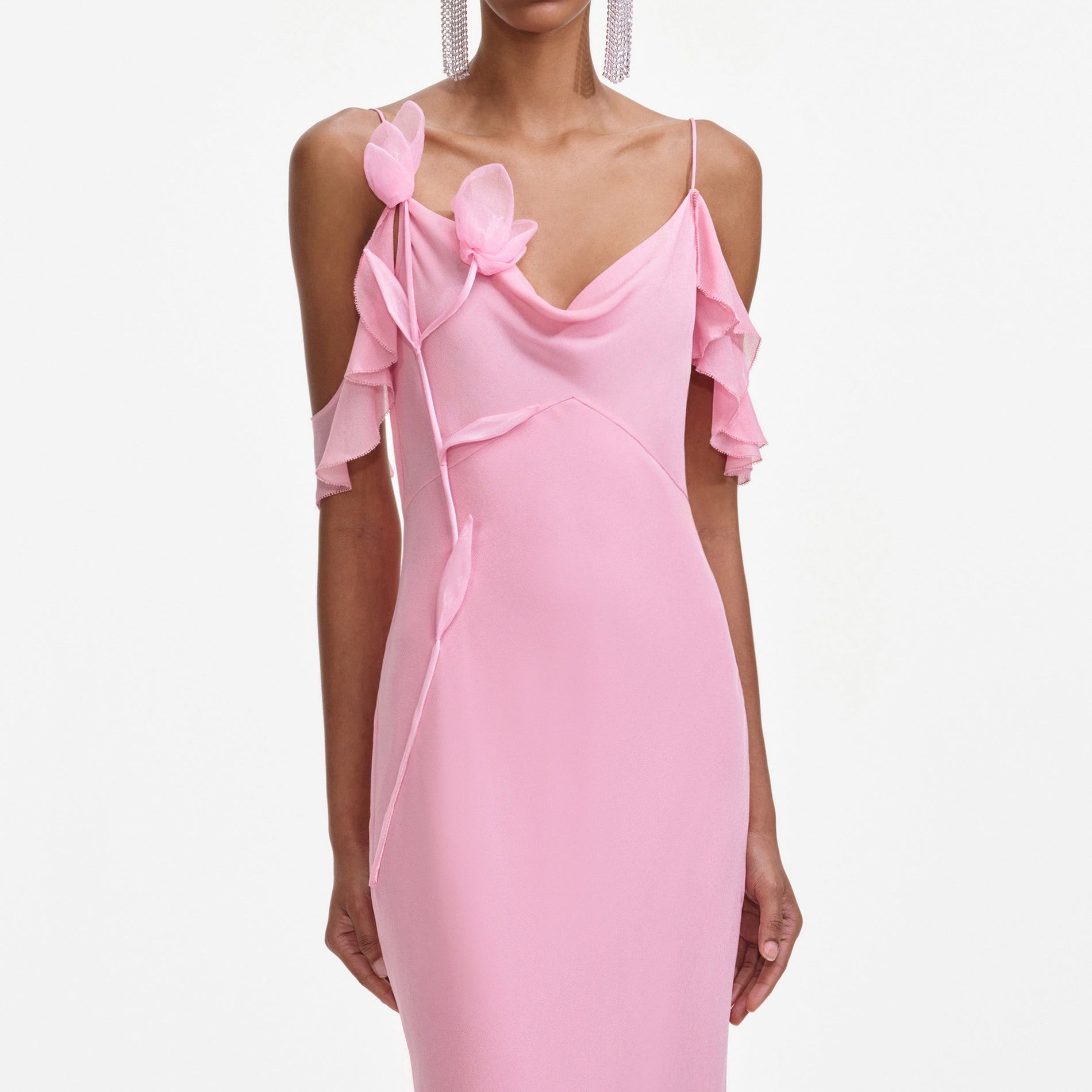 A close up of a woman wearing the Pink Georgette Flower Maxi Dress