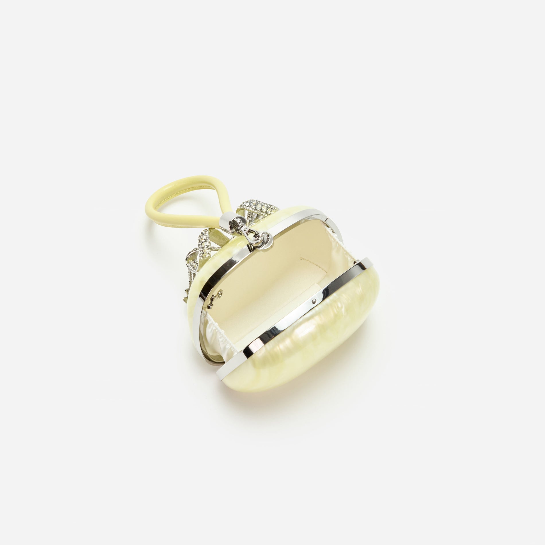 A photo of the Yellow Pearl Top Handle Clutch Bag