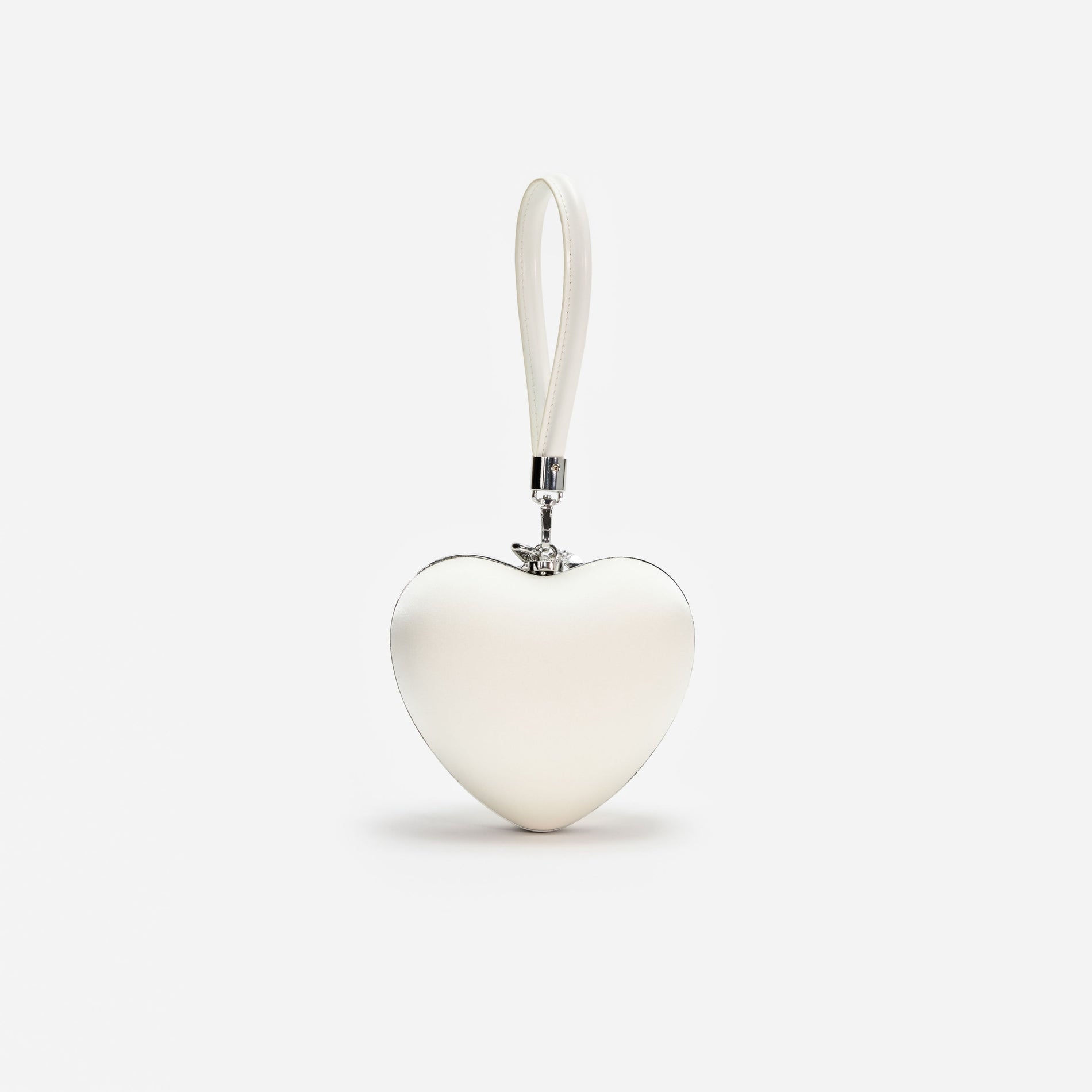 A photo of the Cream Satin Top Handle Heart Clutch