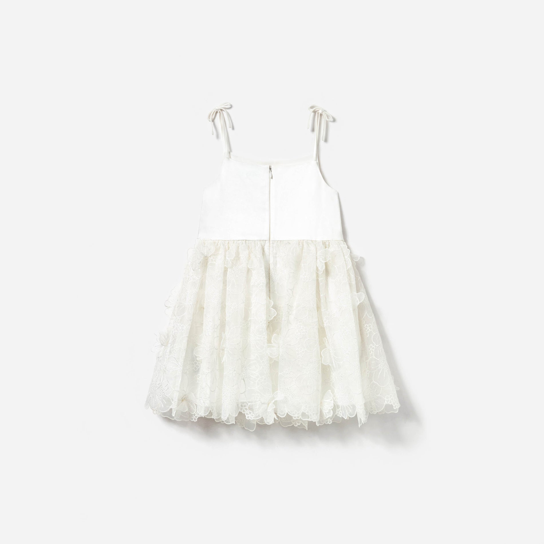 Side view of a woman wearing the White Embellished Tulle Dress