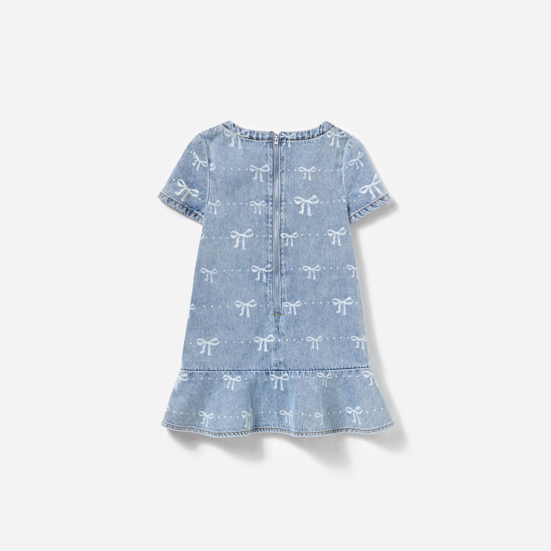 Side view of a woman wearing the Light Blue Bow Denim Dress