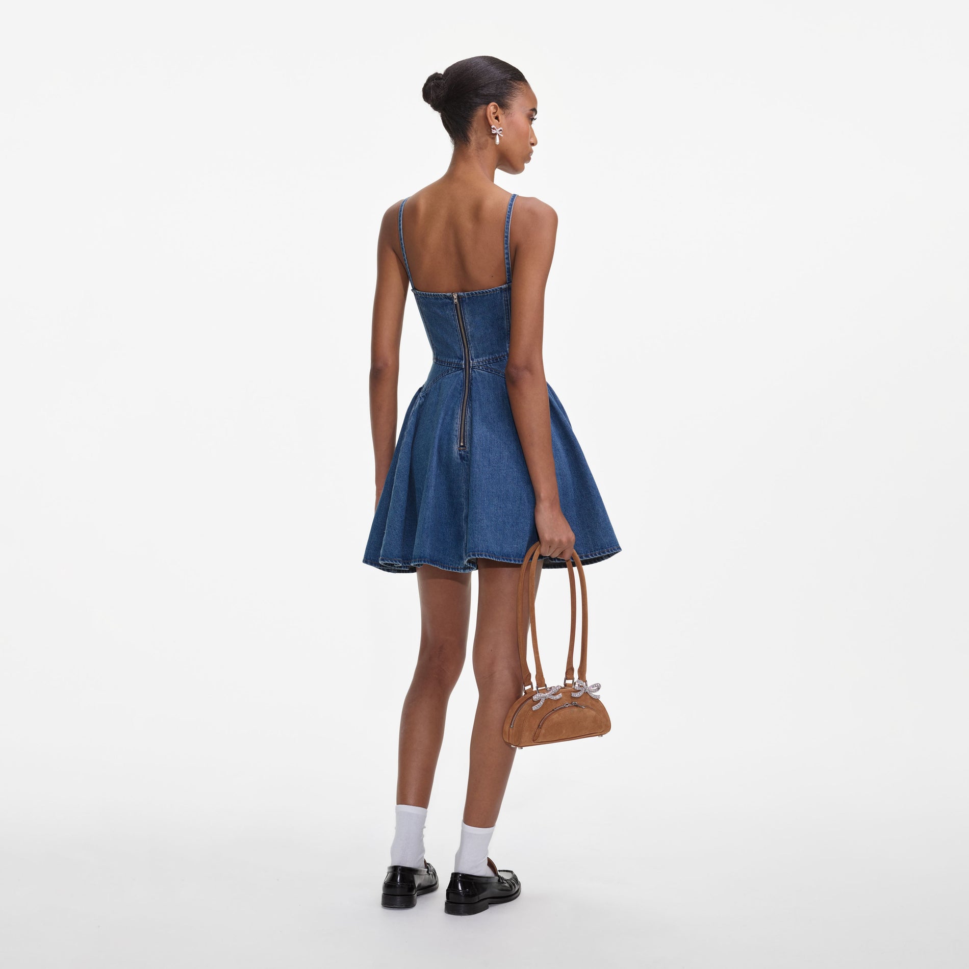 Back view of a woman wearing the Lightweight Denim Flared Mini Dress