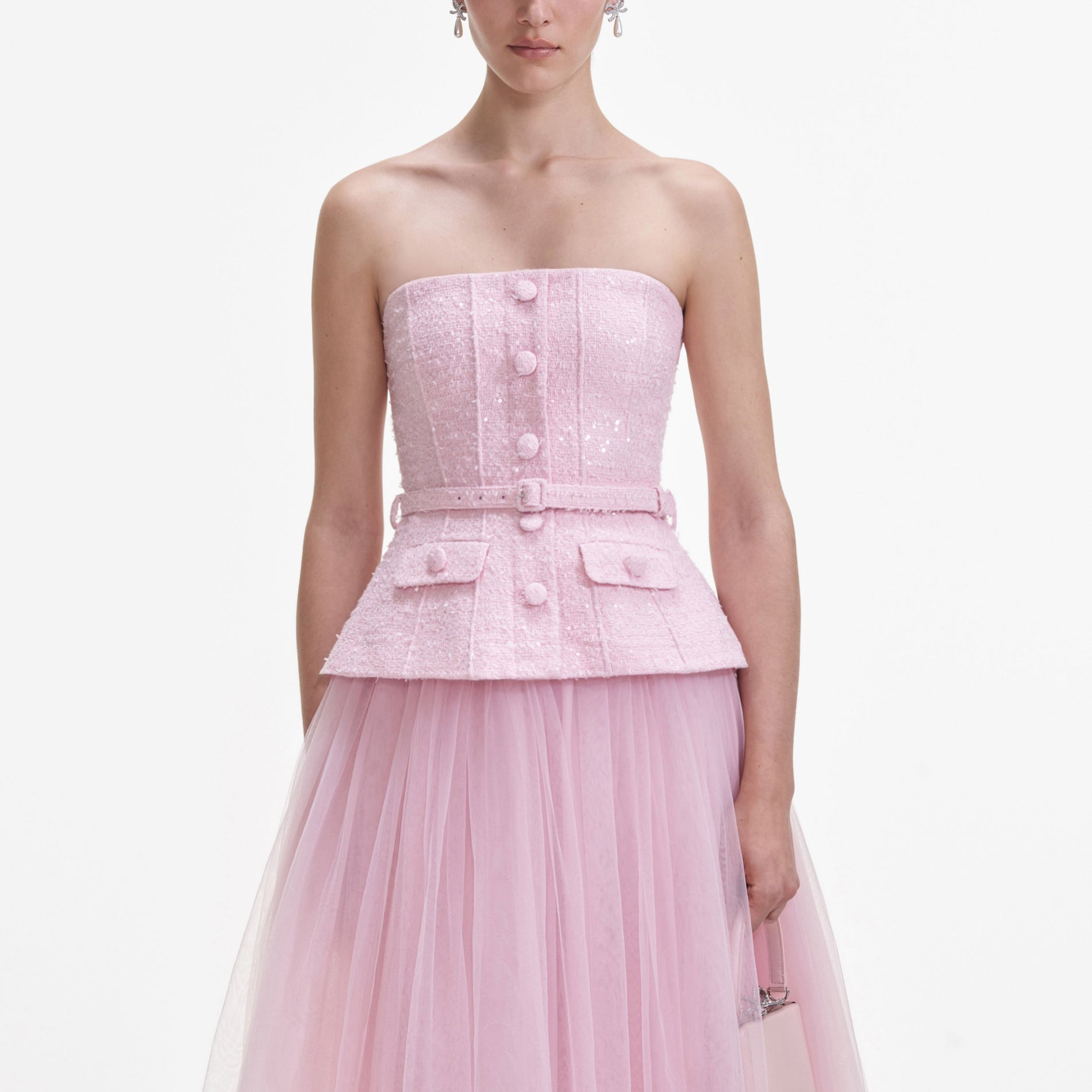 A close up of a woman wearing the Pink Boucle Tulle Midi Dress