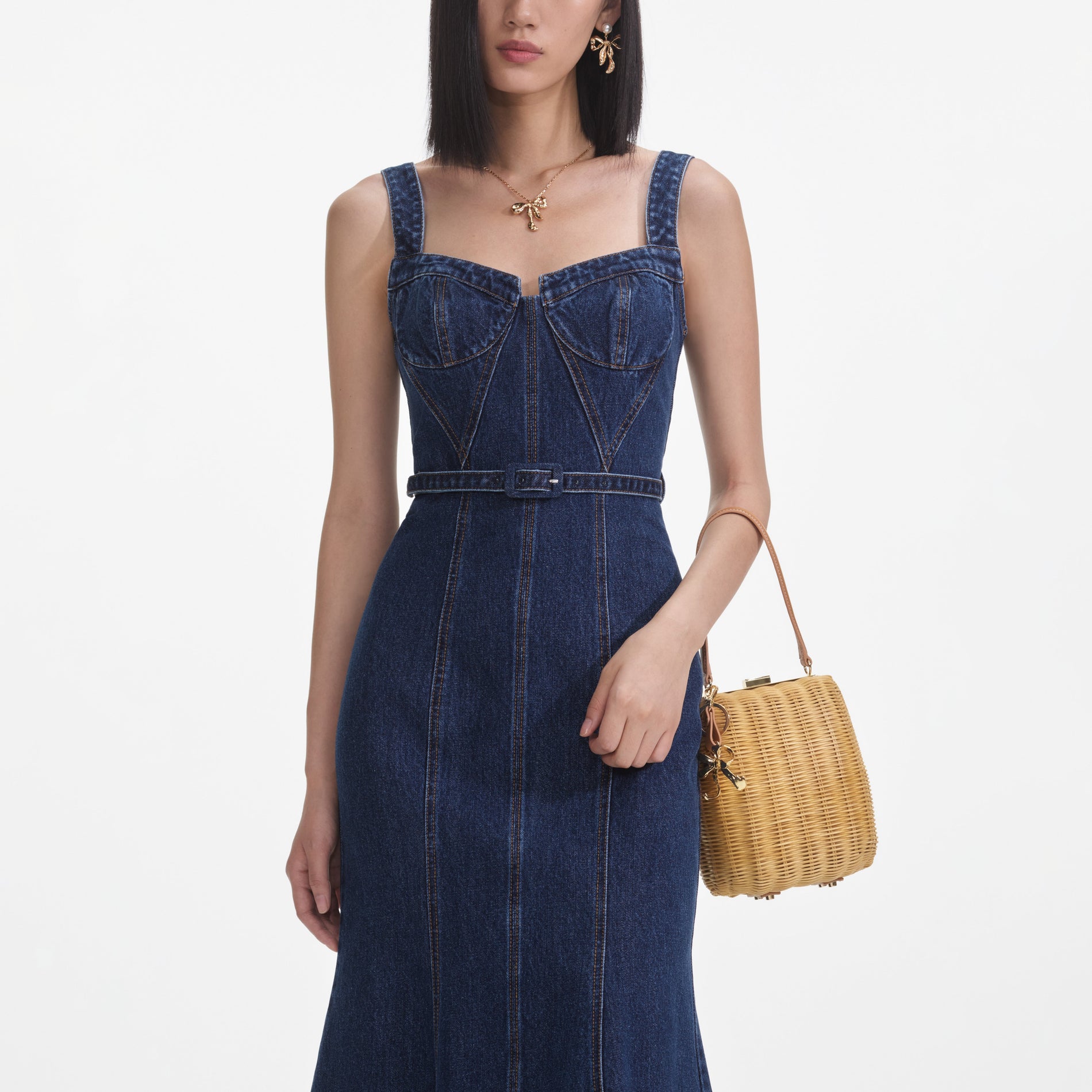 A close up of a woman wearing the Denim Sweetheart Midi Dress