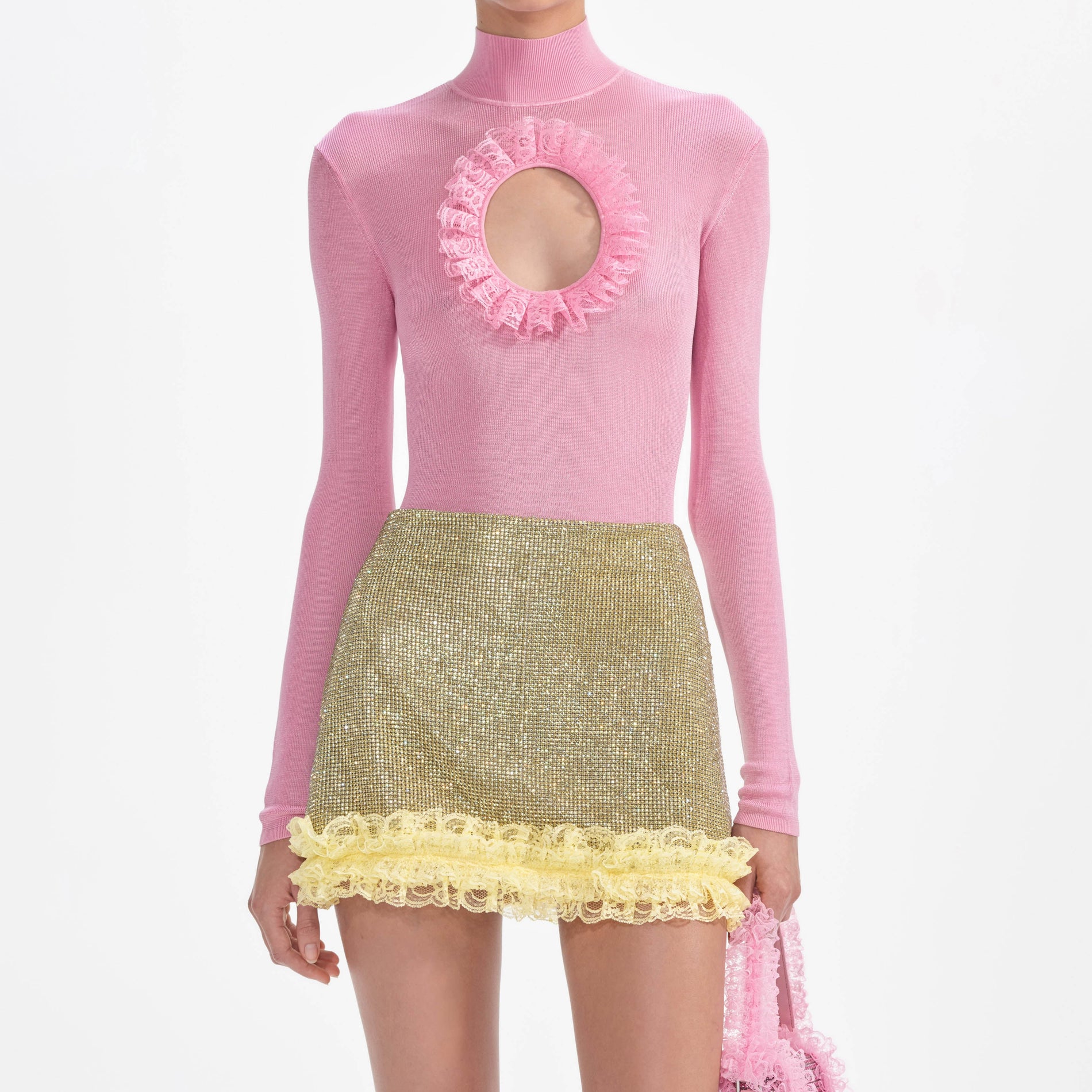 A close up of a woman wearing the Yellow Crystal Chainmail Mini Skirt