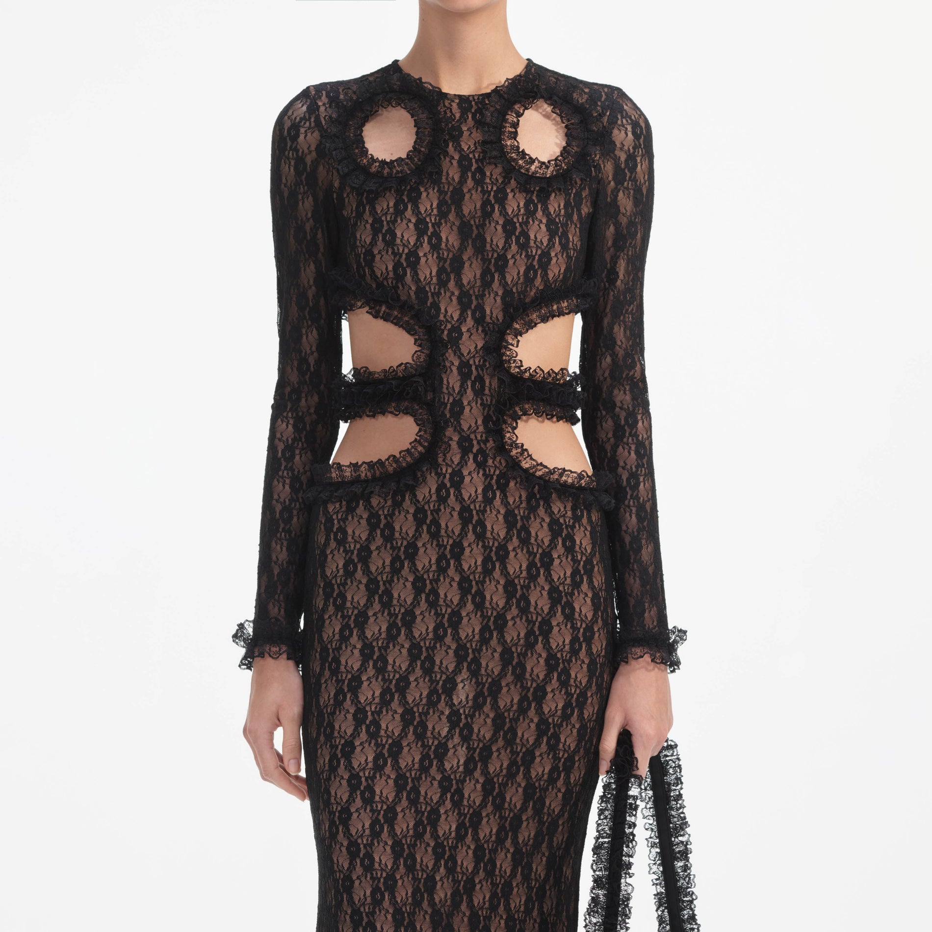 A close up of a woman wearing the Black Lace Cut Out Maxi Dress