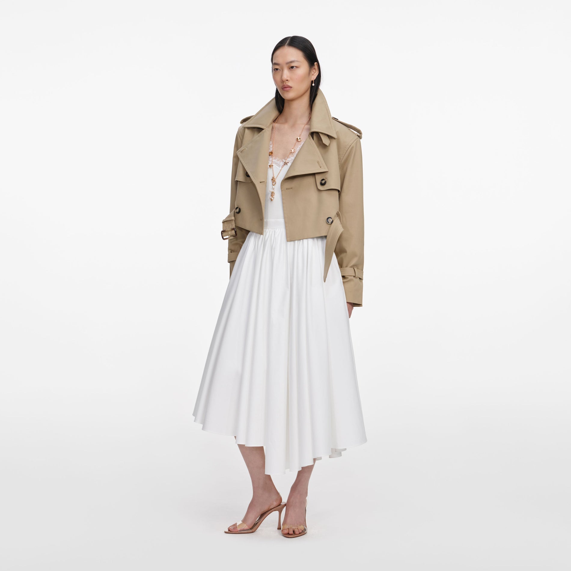Side view of a woman wearing the Beige Cropped Trench Jacket