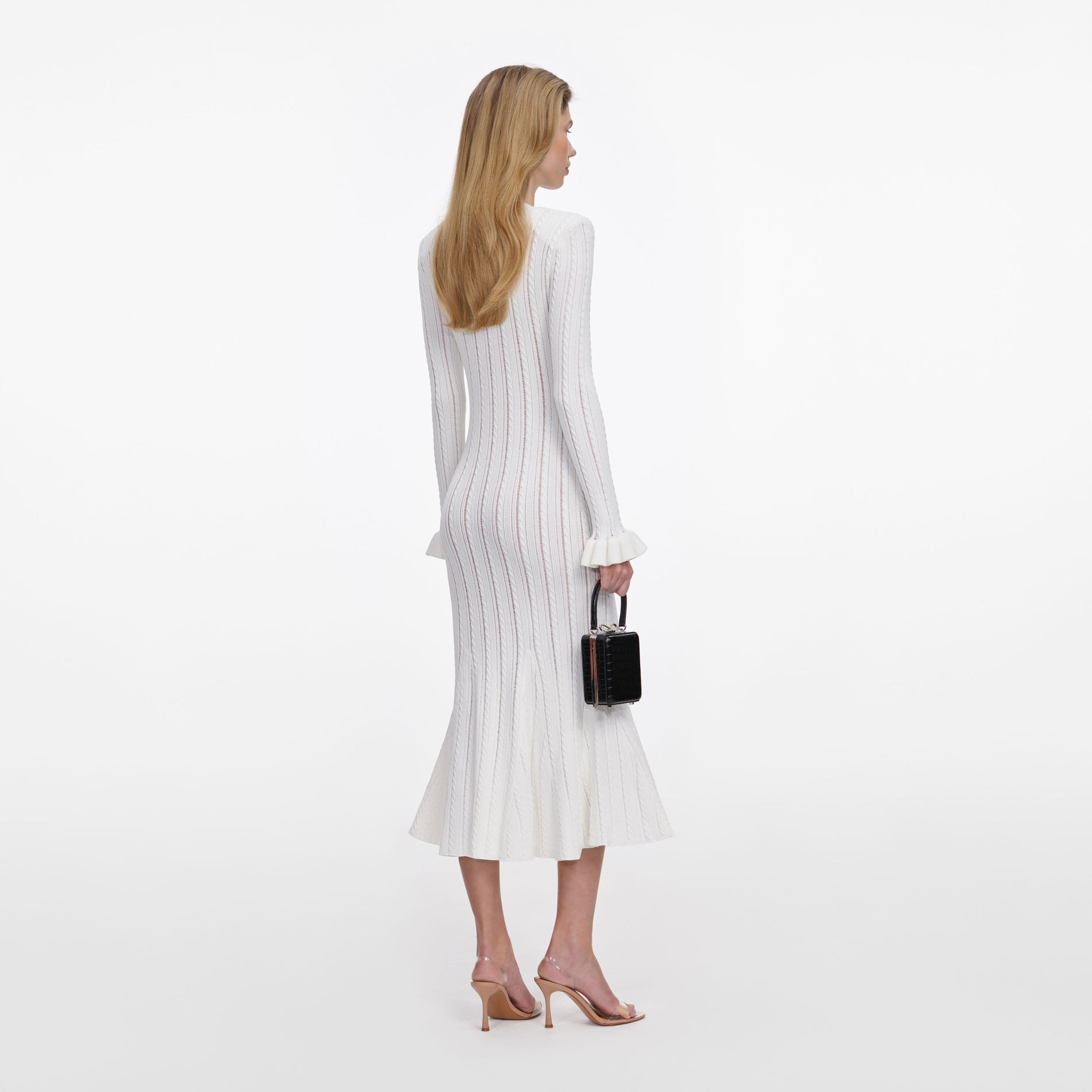 Back view of a woman wearing the White Pointelle Knit Midi Dress