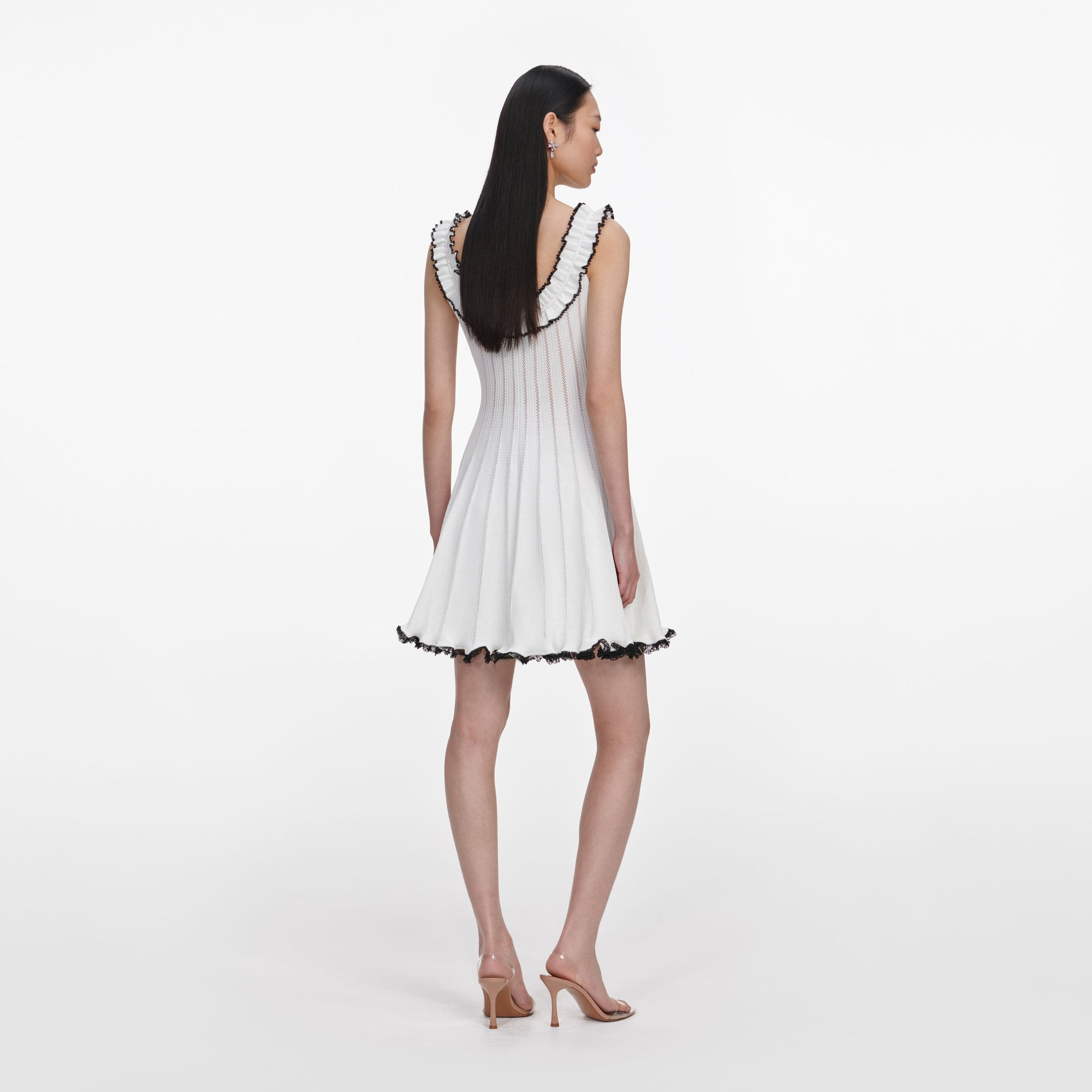 Back view of a woman wearing the White Contrast Trim Knit Mini Dress