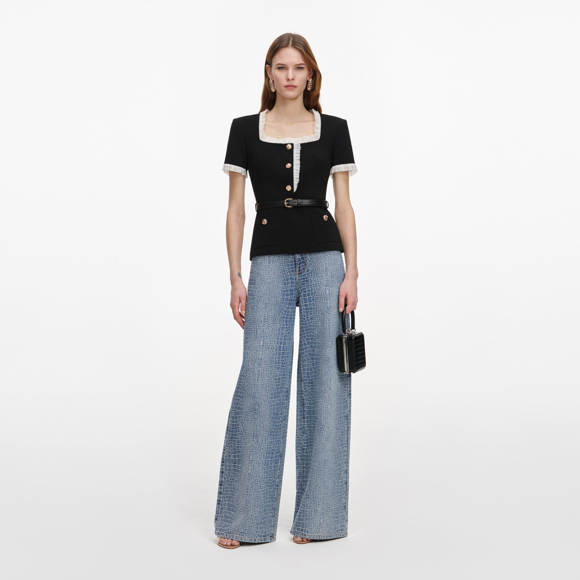 Front view of a woman wearing the Black Crepe Contrast Frill Top