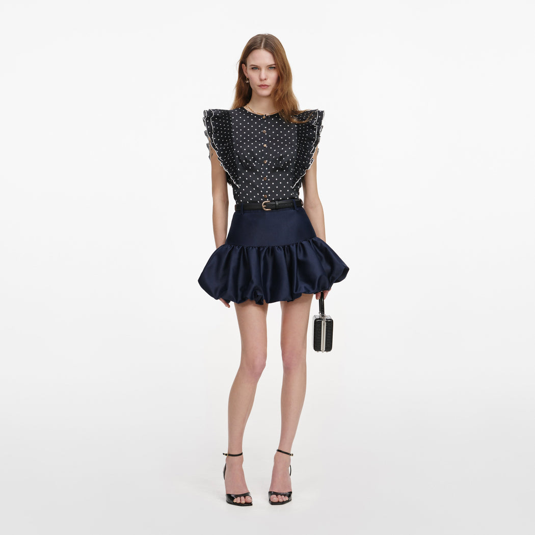 Front view of a woman wearing the Navy Taffeta Skirt