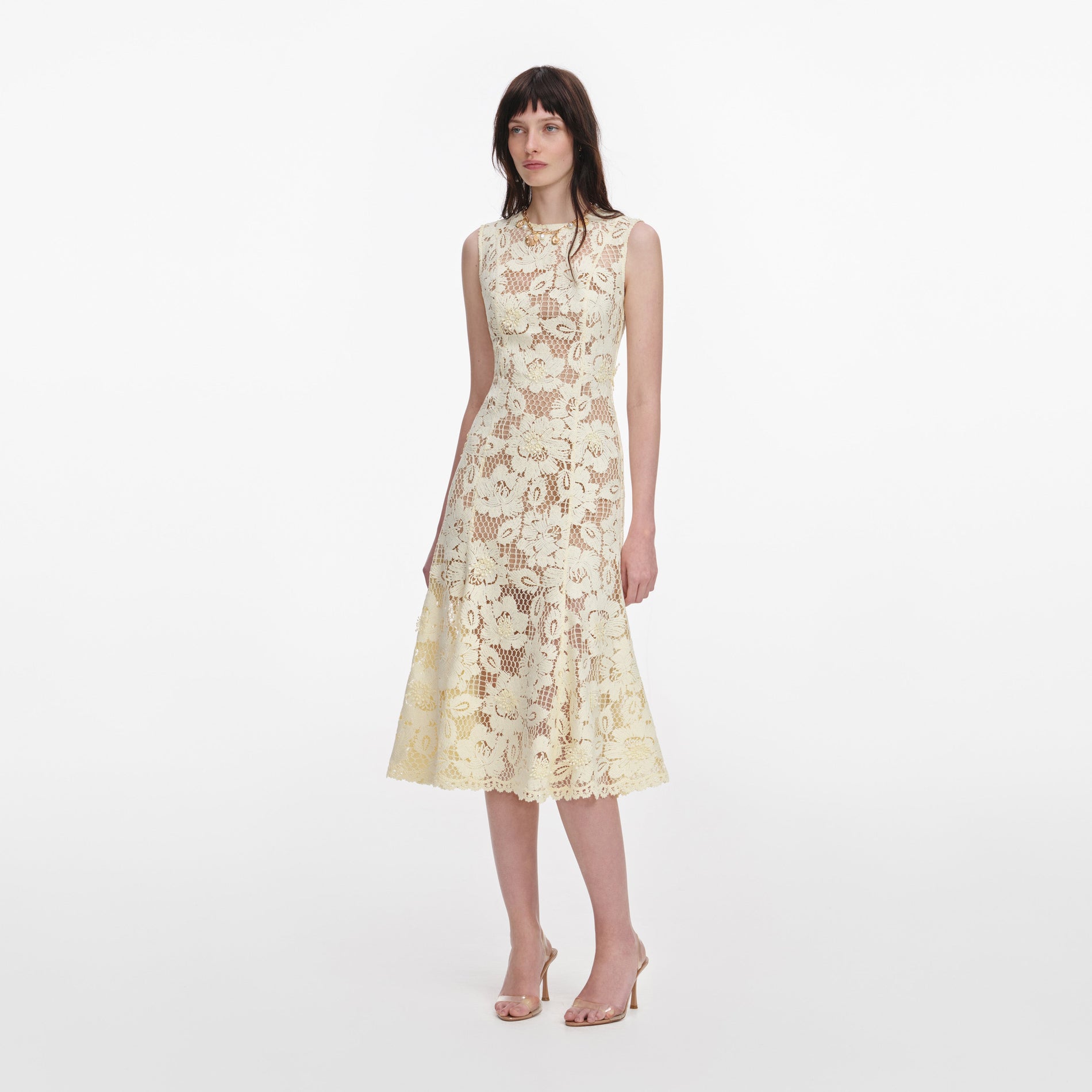 Side view of a woman wearing the Yellow Crochet Lace Midi Dress