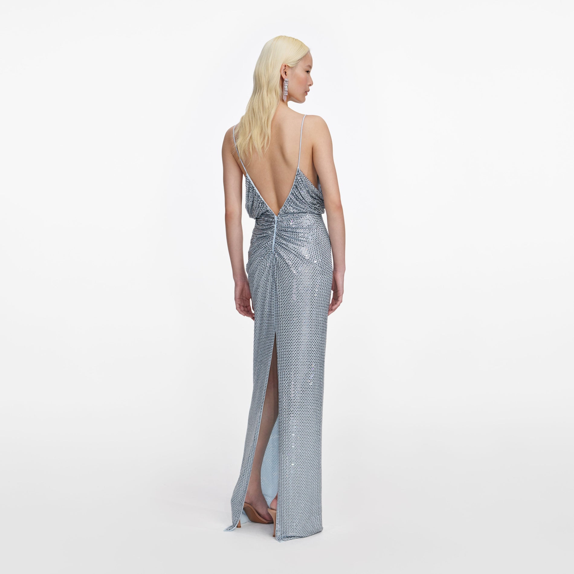 Back view of a woman wearing the Blue Rhinestone Mesh Maxi Dress