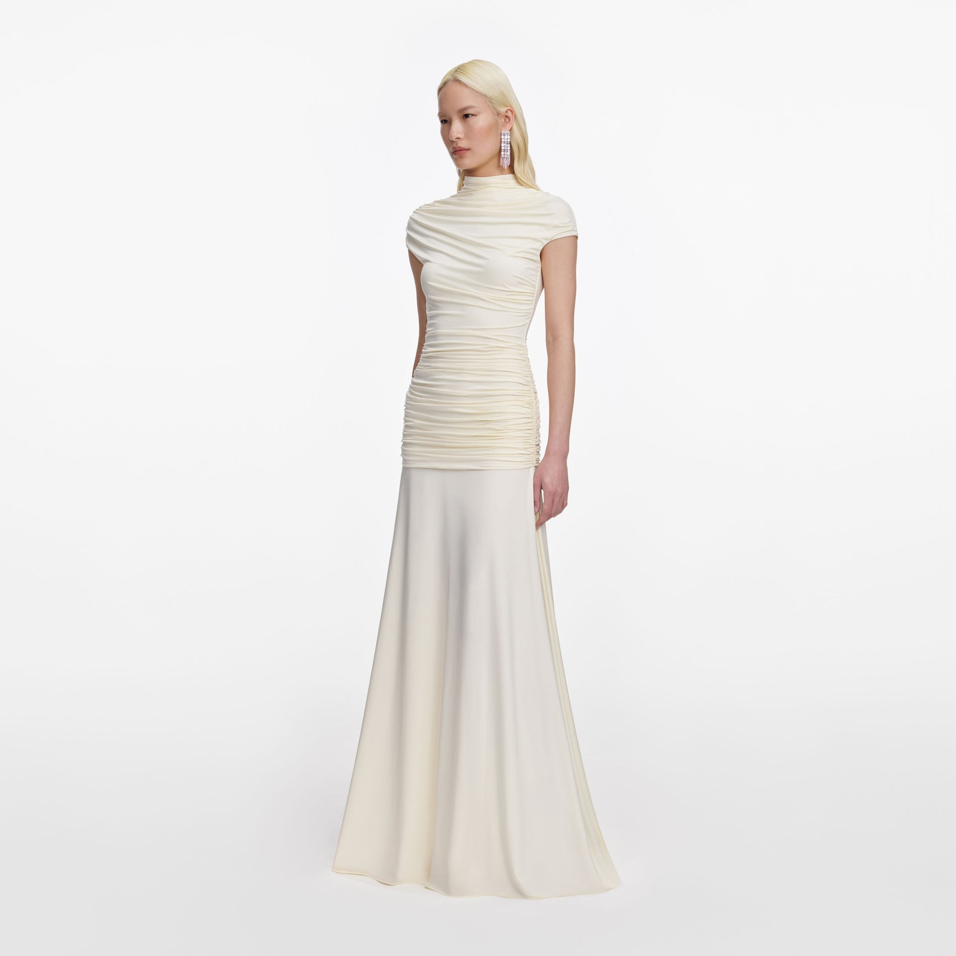 Side view of a woman wearing the Yellow Jersey Draped Maxi Dress