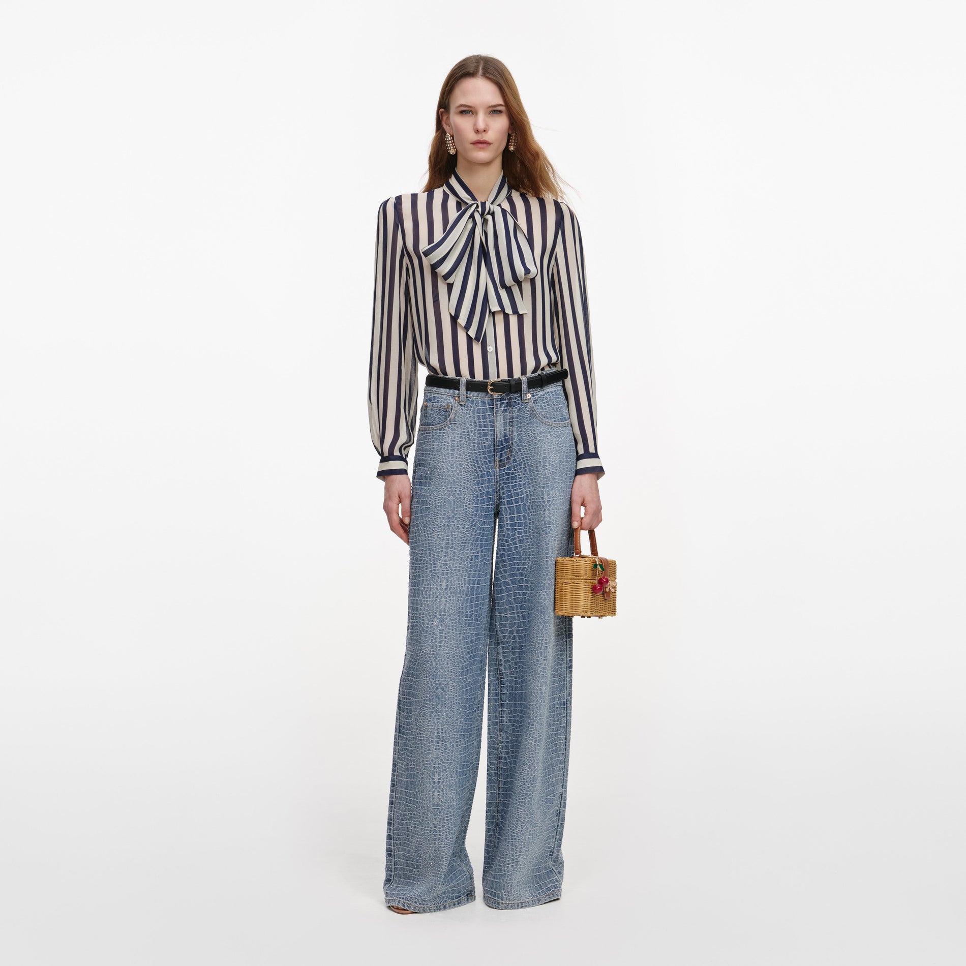 Front view of a woman wearing the Navy Stripe Tie Neck Blouse