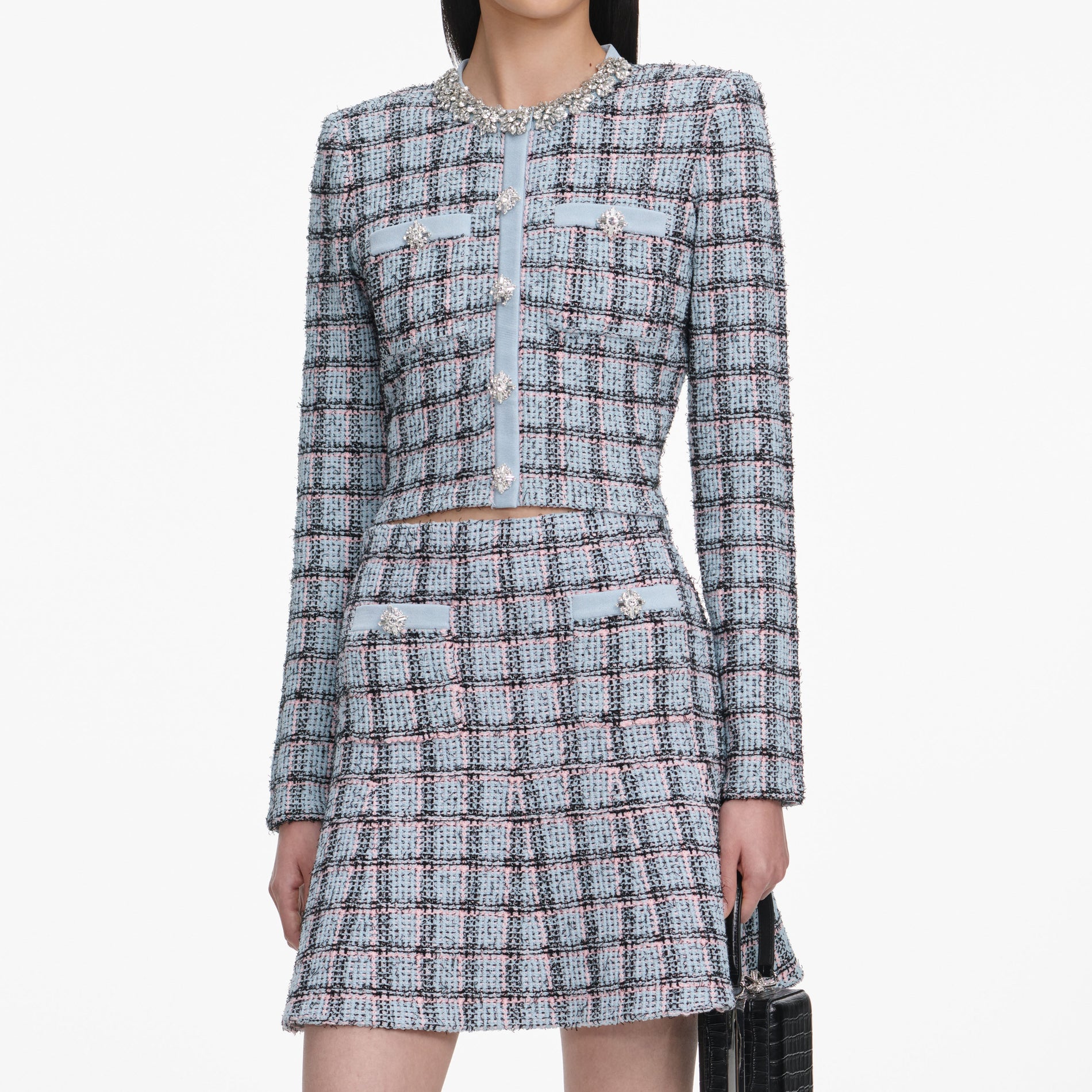 A close up of a woman wearing the Blue Check Knit Cardigan