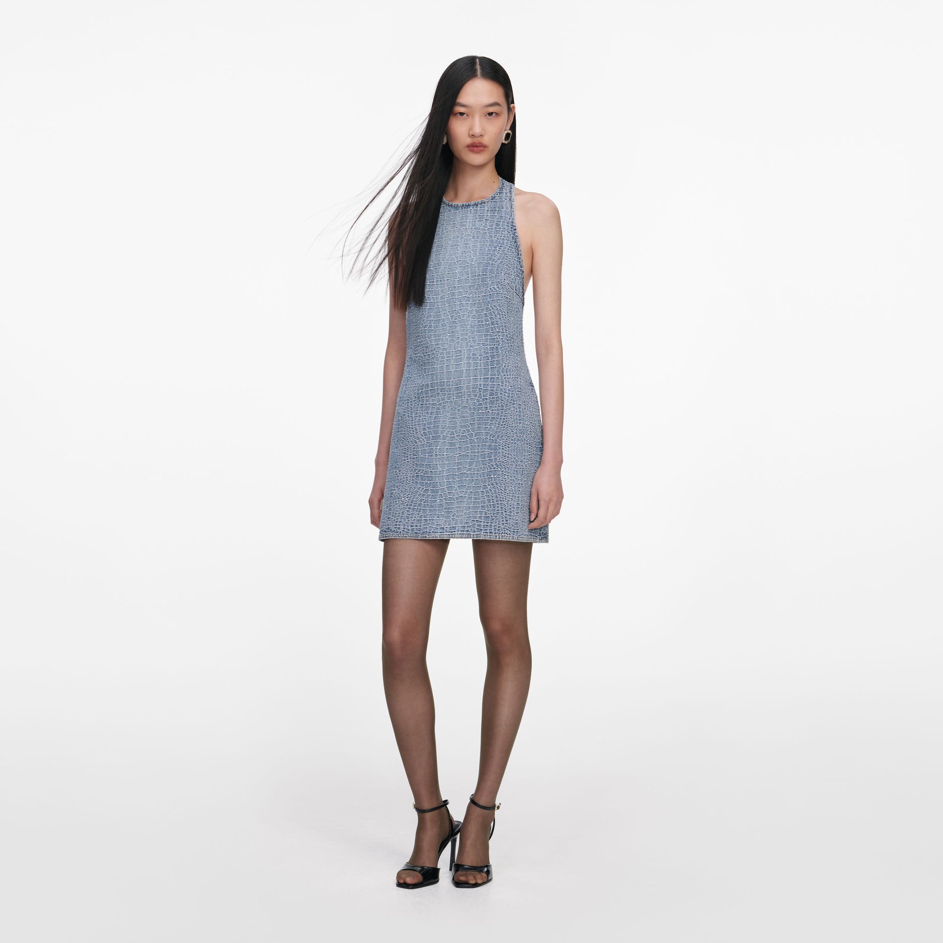 Side view of a woman wearing the Rhinestone Croc Effect Denim Mini Dress