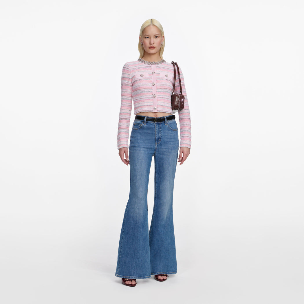 Front view of a woman wearing the Mid Blue Flared Jeans