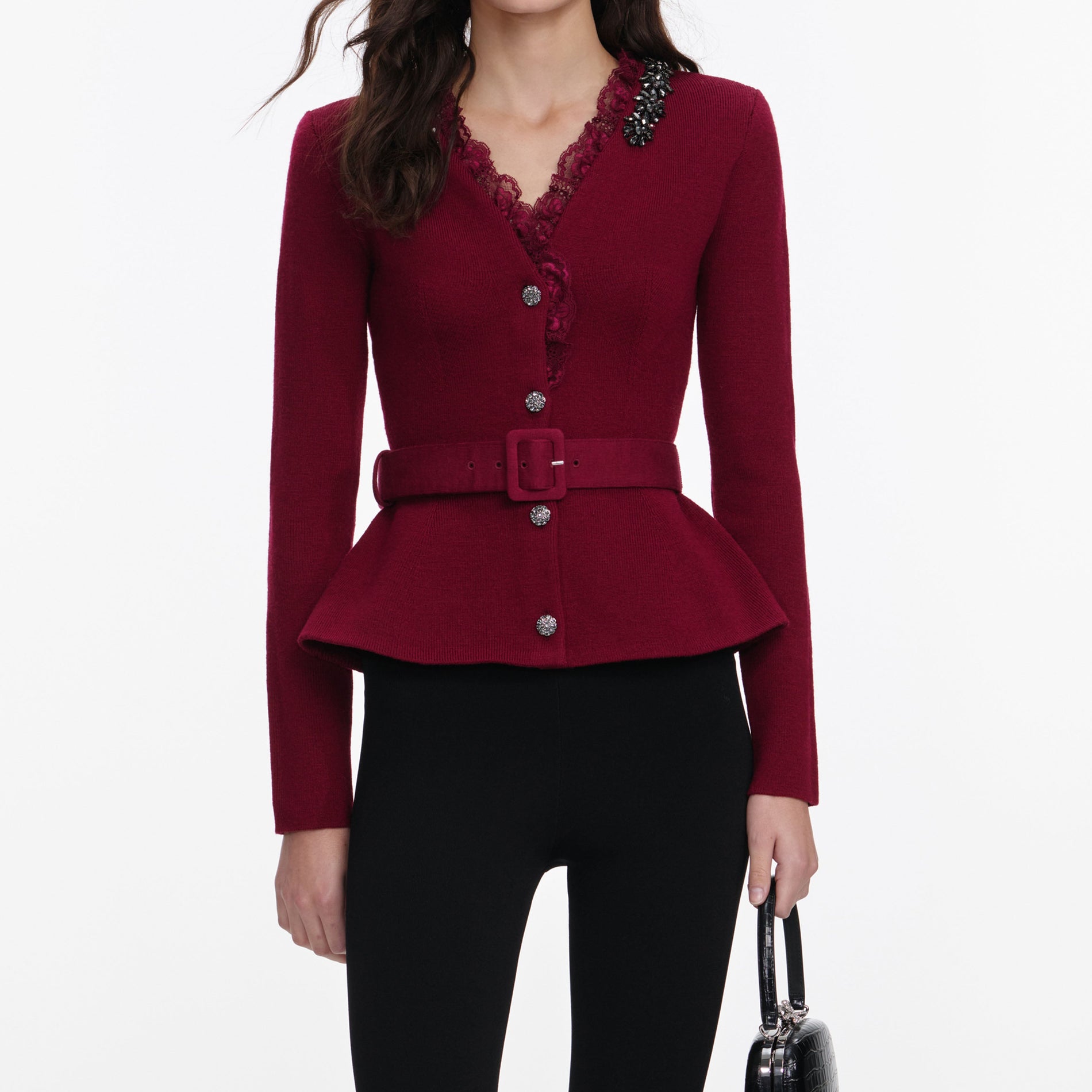 A close up of a woman wearing the Burgundy Crystal Trim Cardigan