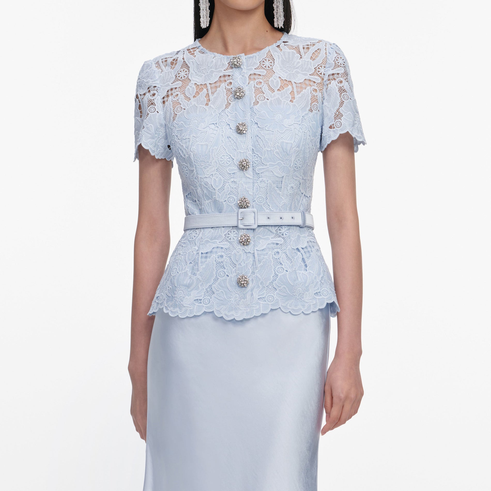 A close up of a woman wearing the Blue Lace Satin Maxi Dress