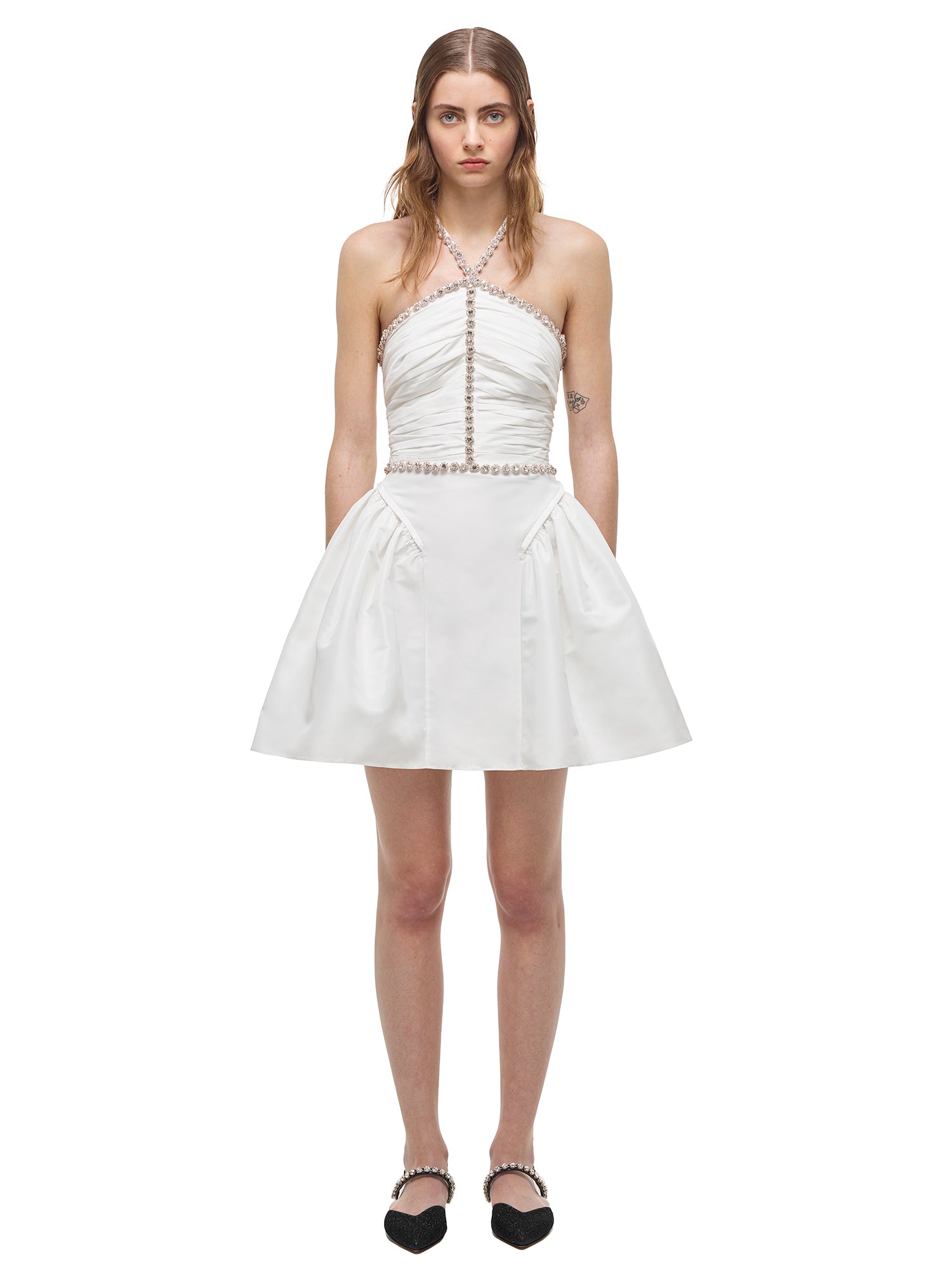 A woman wearing the White Taffeta Diamante Trim Mini Dress