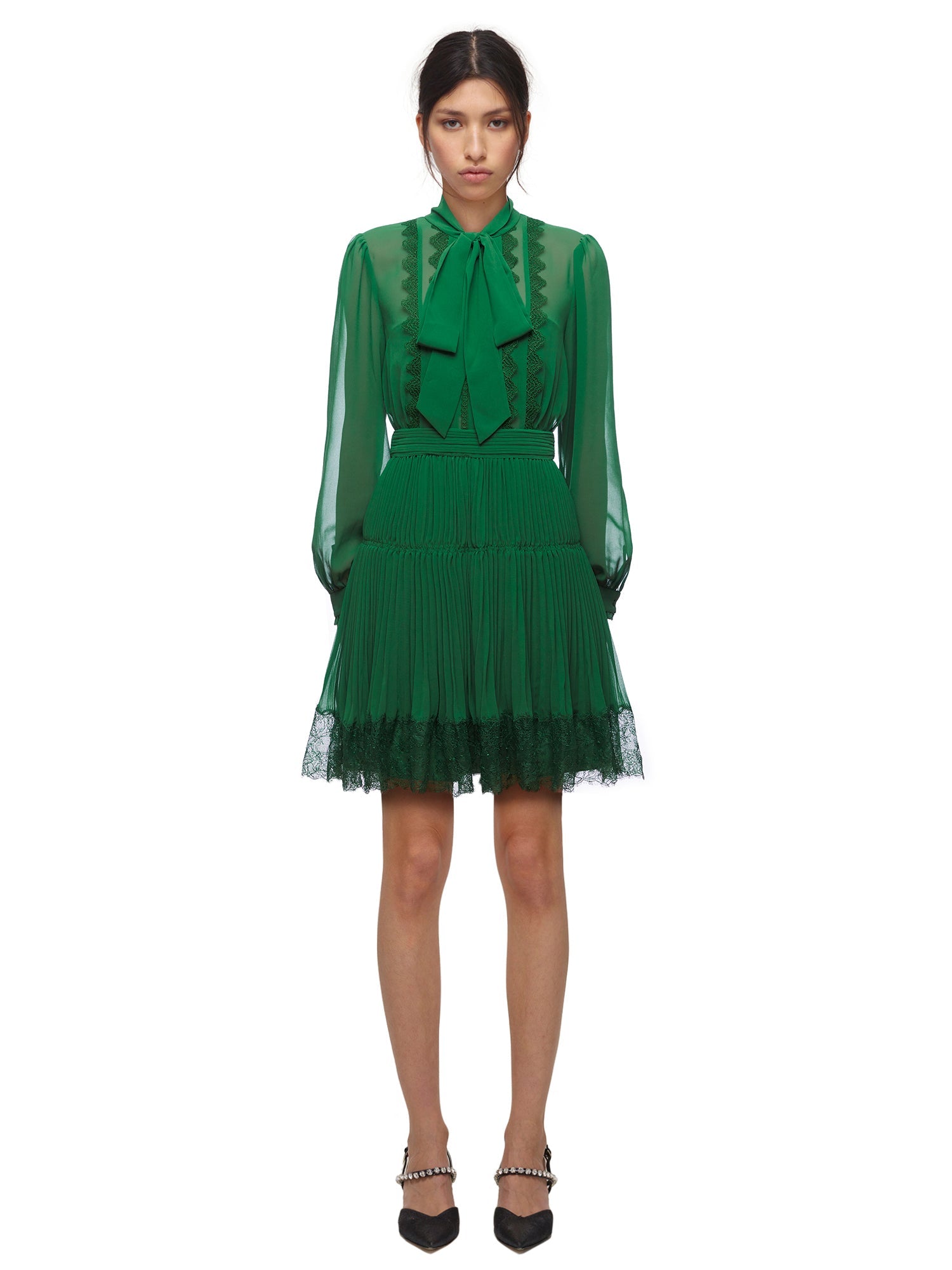 A woman wearing the Green Chiffon Mini Dress