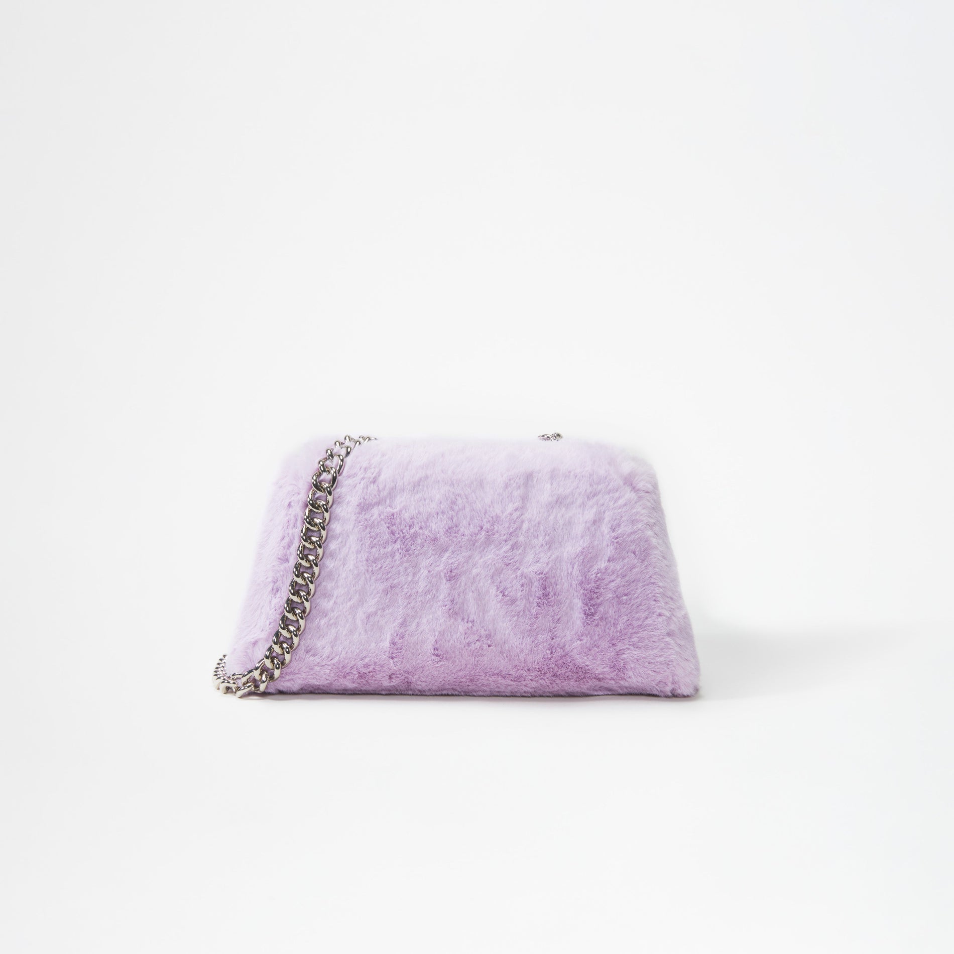 A woman wearing the Lilac Fluffy Bow Mini Bag