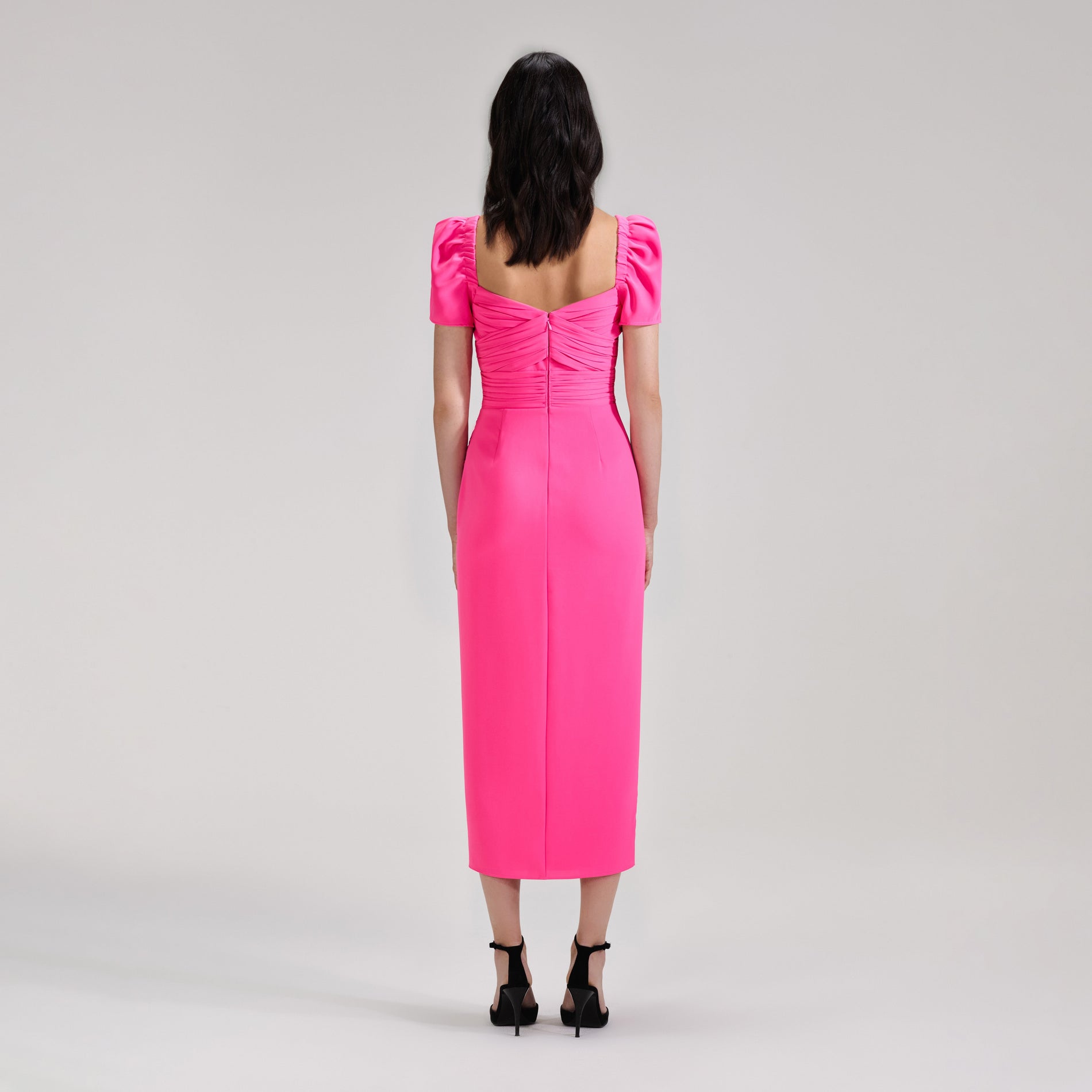 A woman wearing the Bright Pink Iris Midi Dress