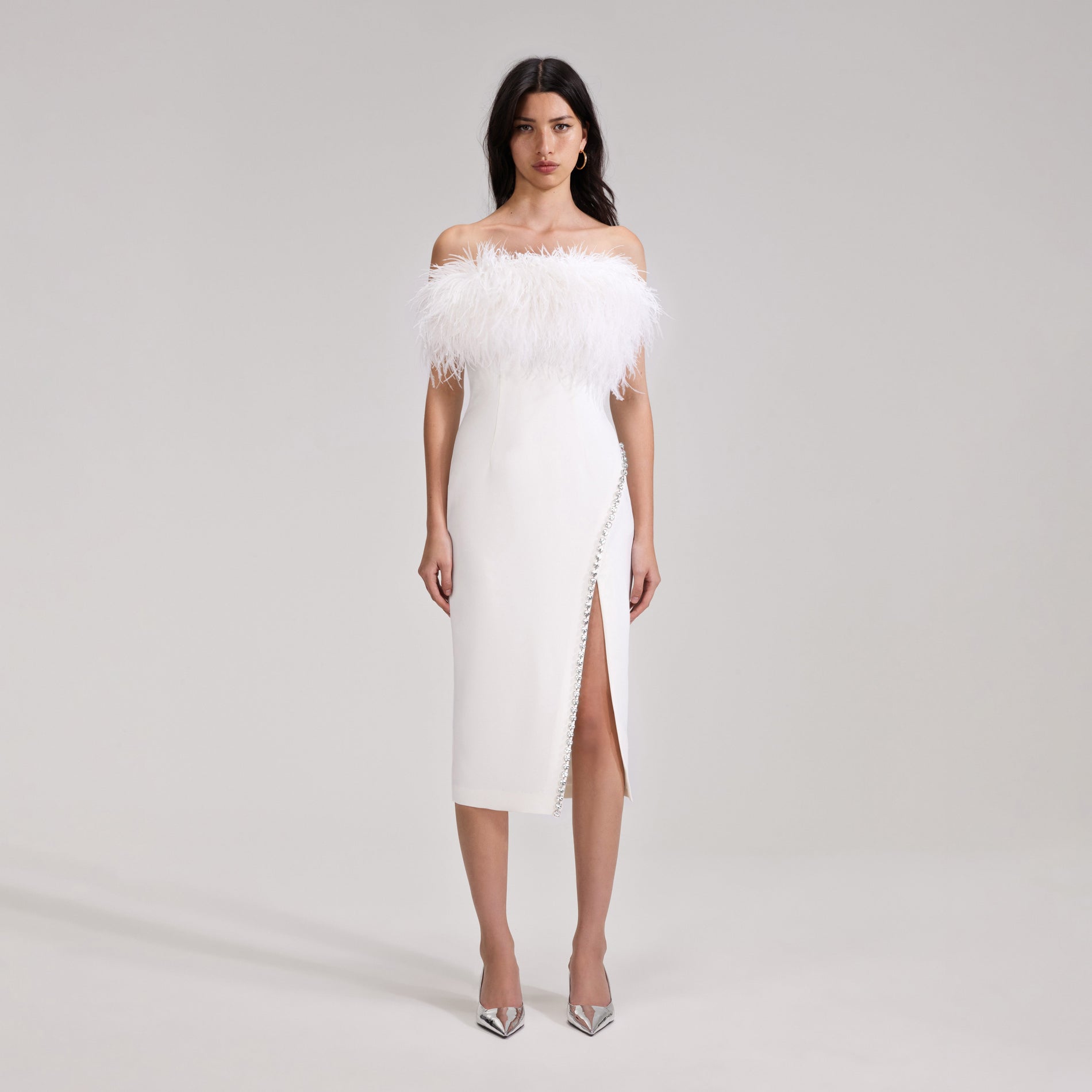 A woman wearing the White Feather Midi Dress