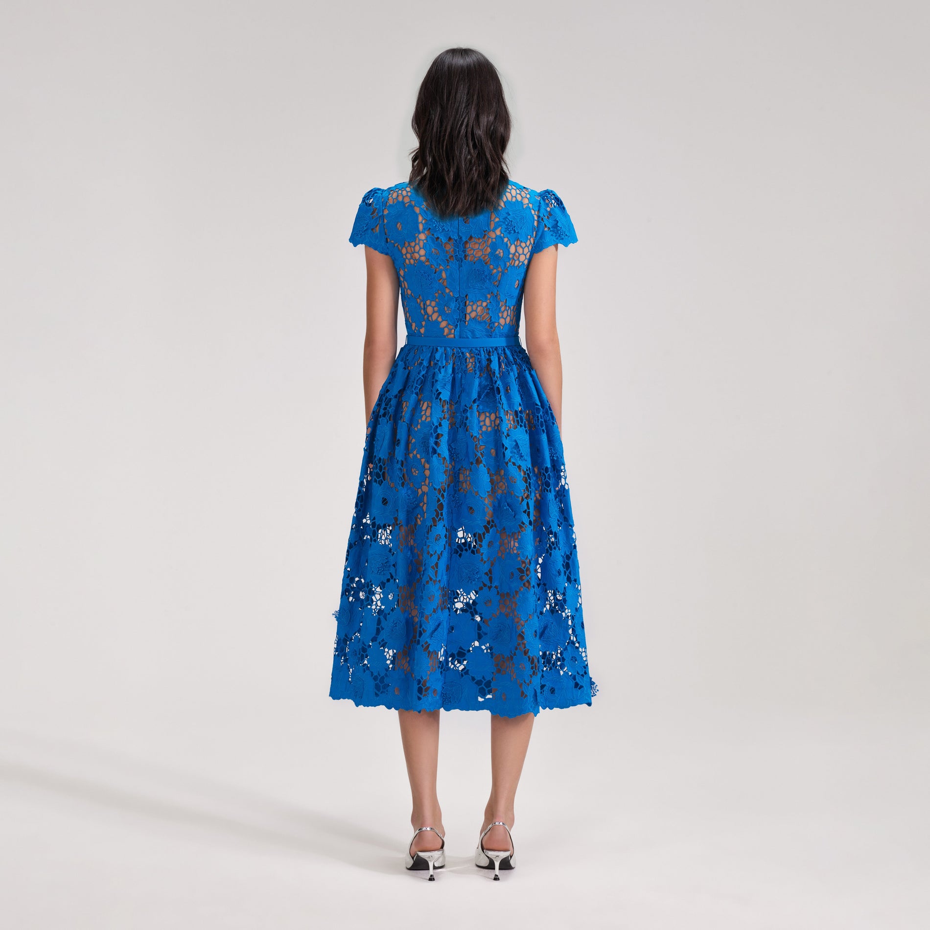 A woman wearing the Blue Poppy Midi Dress
