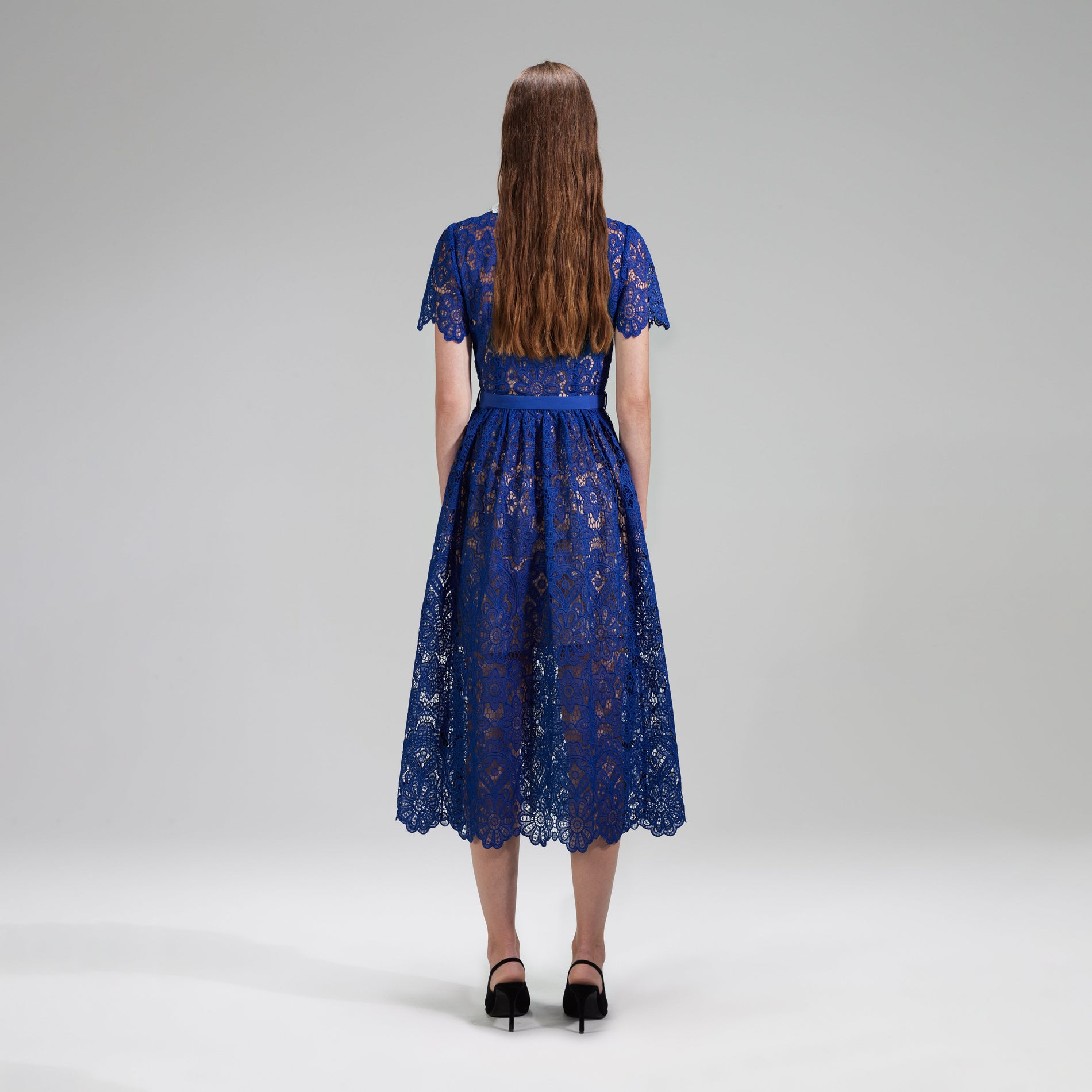 A woman wearing the Blue Lace Midi Dress Contrast Collar